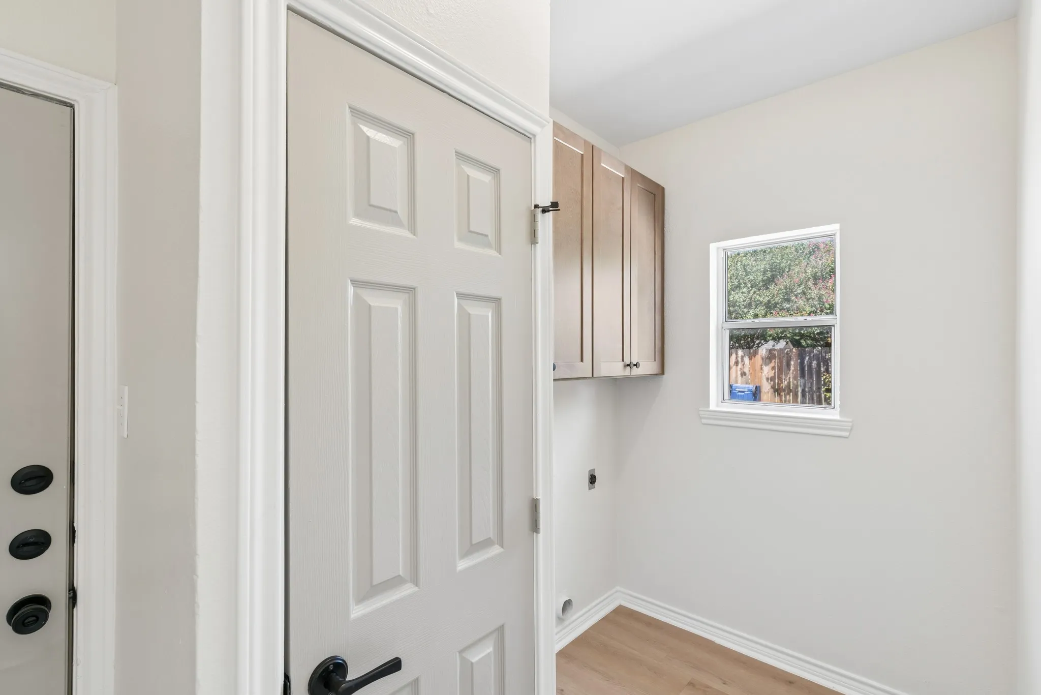 White paneled door with matte black hardware