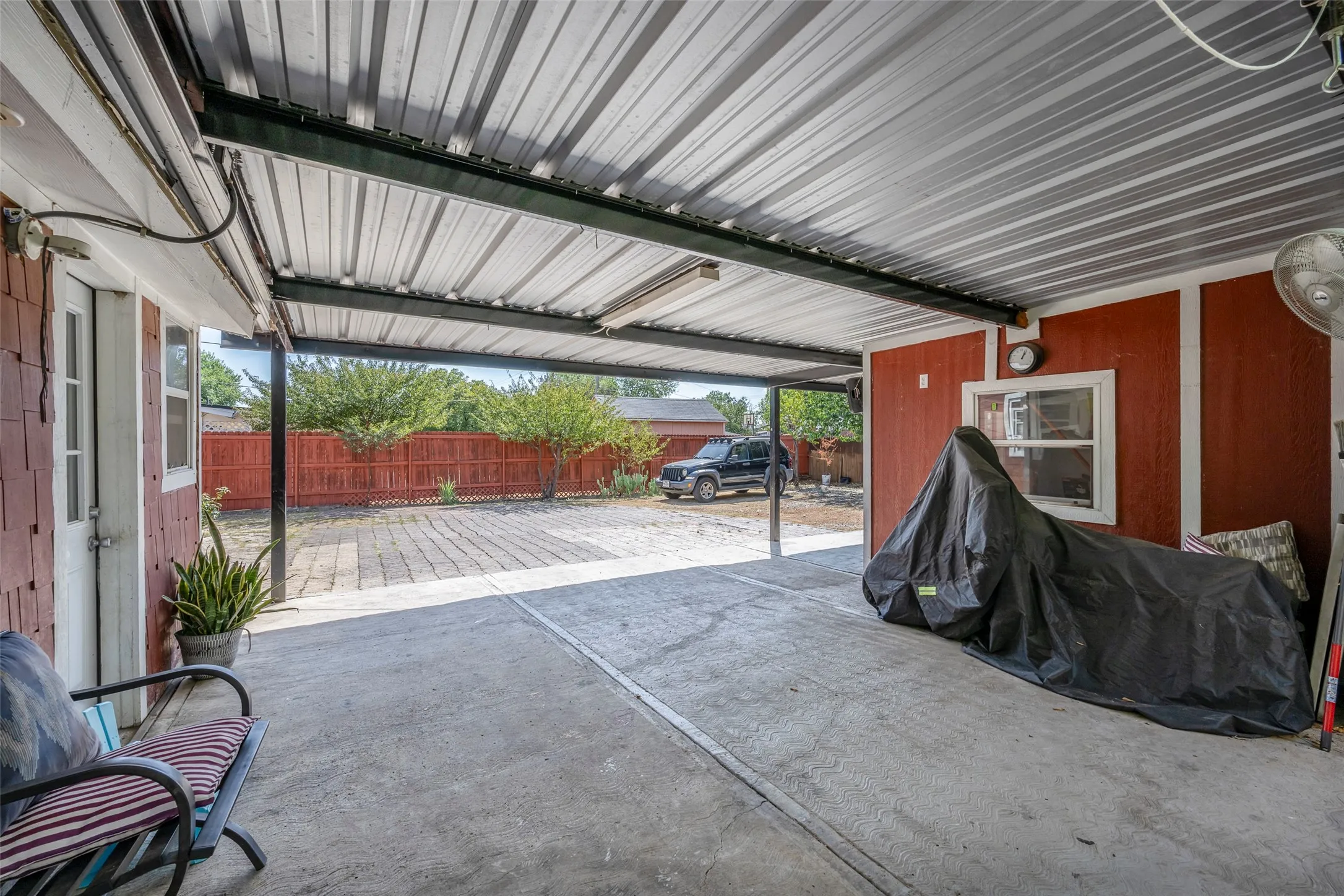 Covered carport, additional guest bedroom/ study