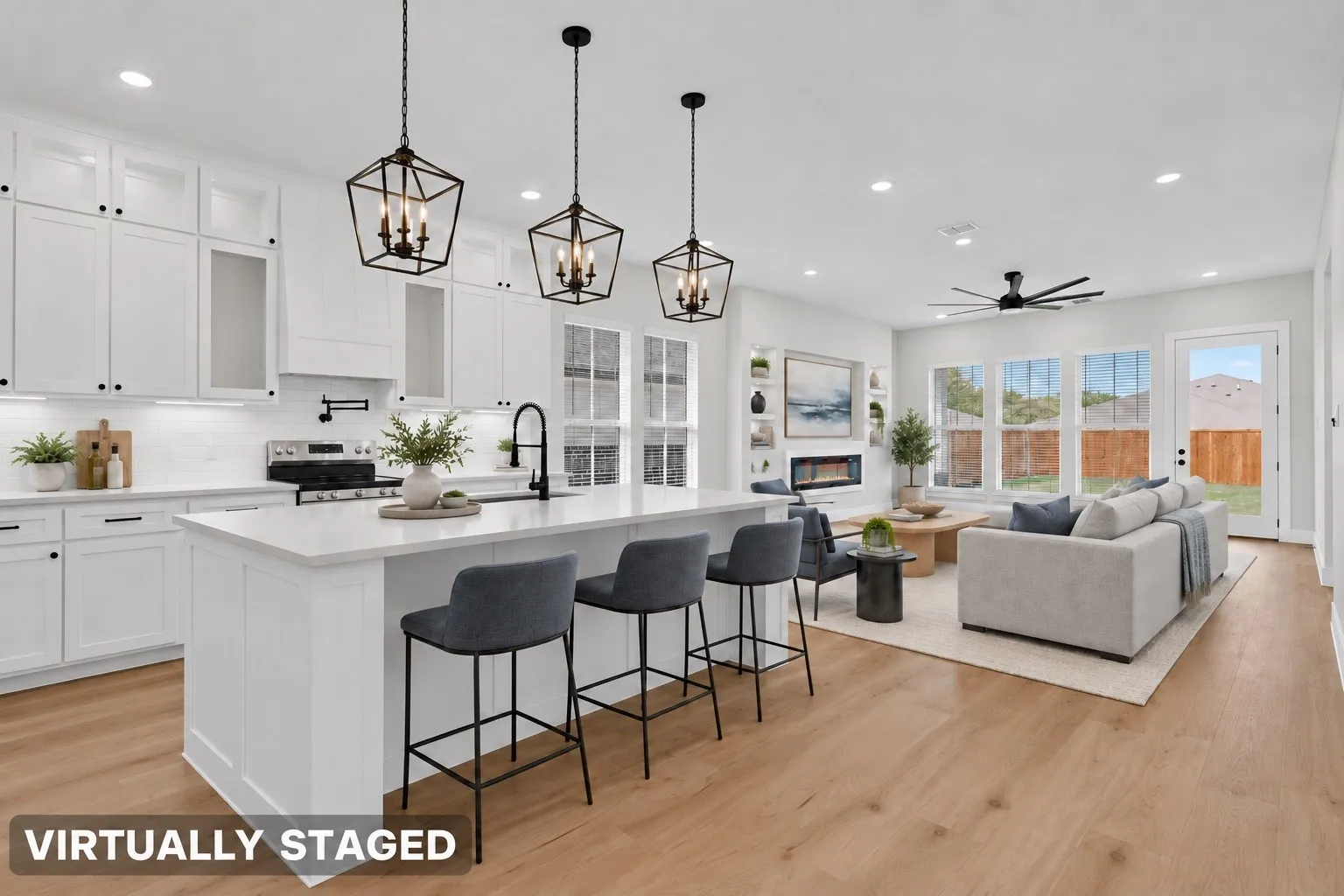 Open-concept living area featuring a kitchen island, recessed lighting, wood-finish flooring, and multiple windows