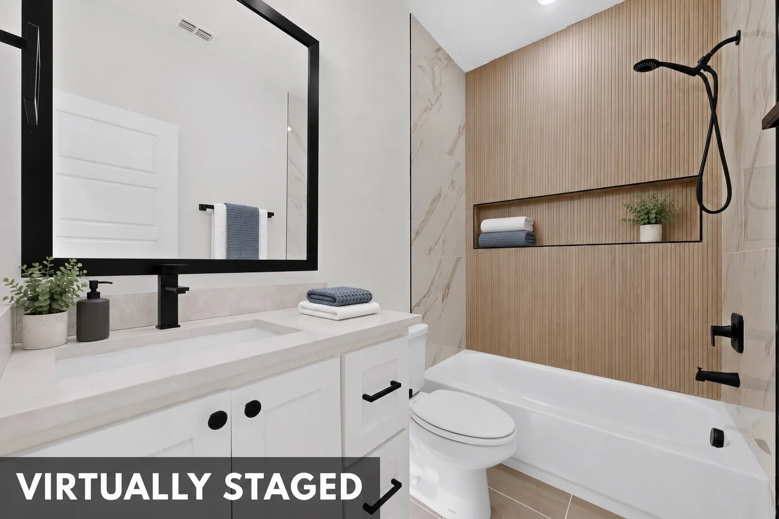 White vanity with a light-toned countertop, rectangular undermount sink, and matte black faucet