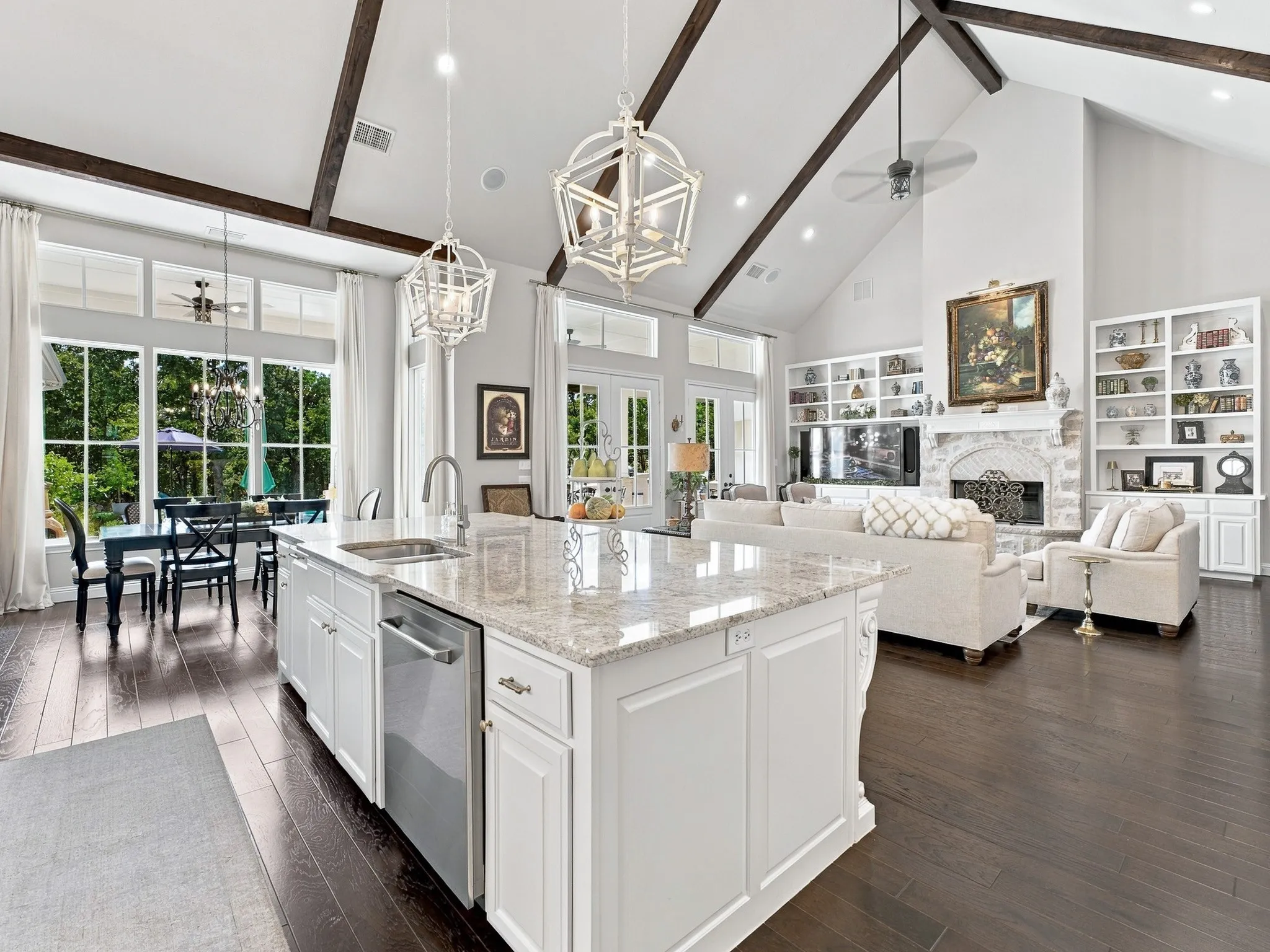 Gourmet kitchen island with granite countertop and stainless steel appliances