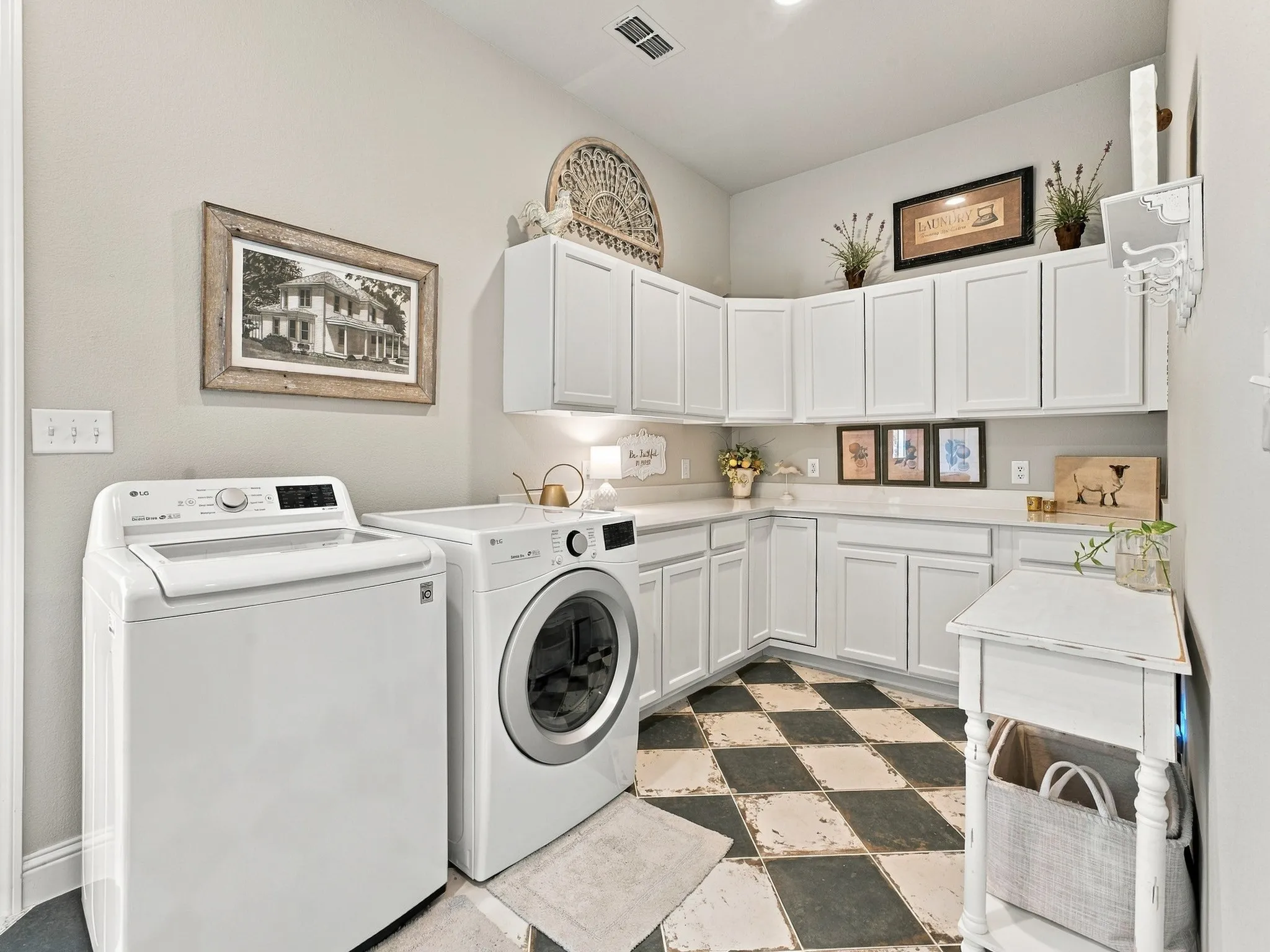 Checkered flooring, white shaker-style cabinetry, white countertops, and a built-in shelf