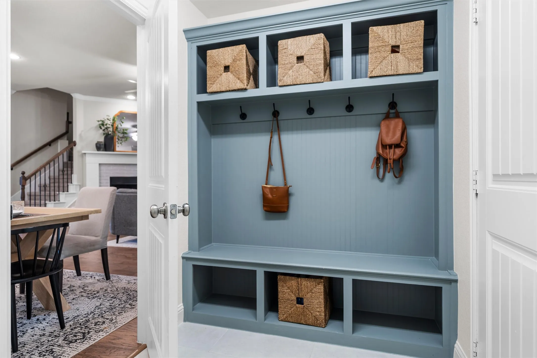 Built-in storage bench with beadboard backing, upper cubbies, and lower compartments