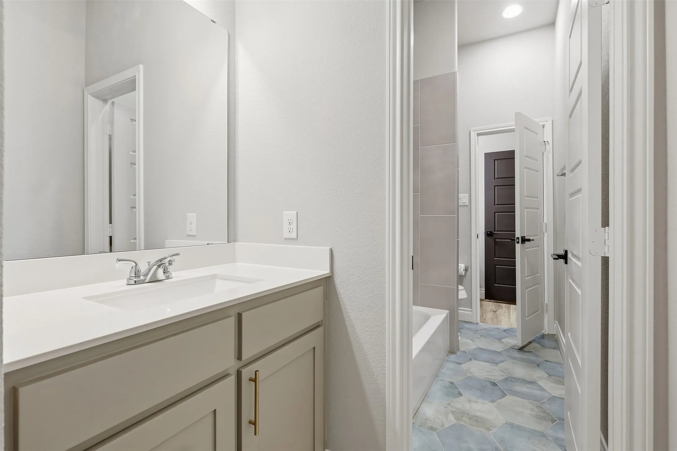 Vanity with an integrated sink and chrome faucet