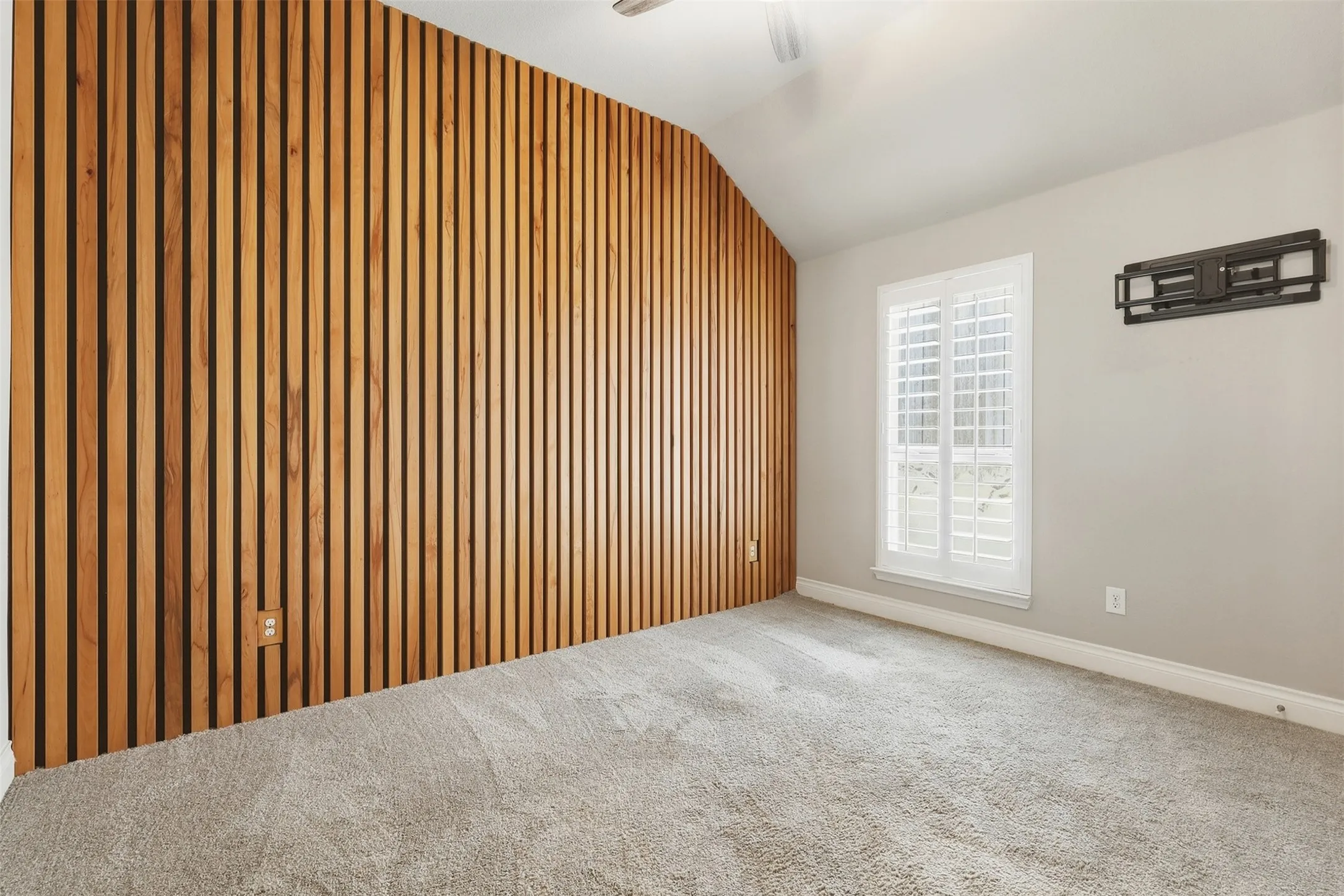 Accent wall featuring wood slat detailing