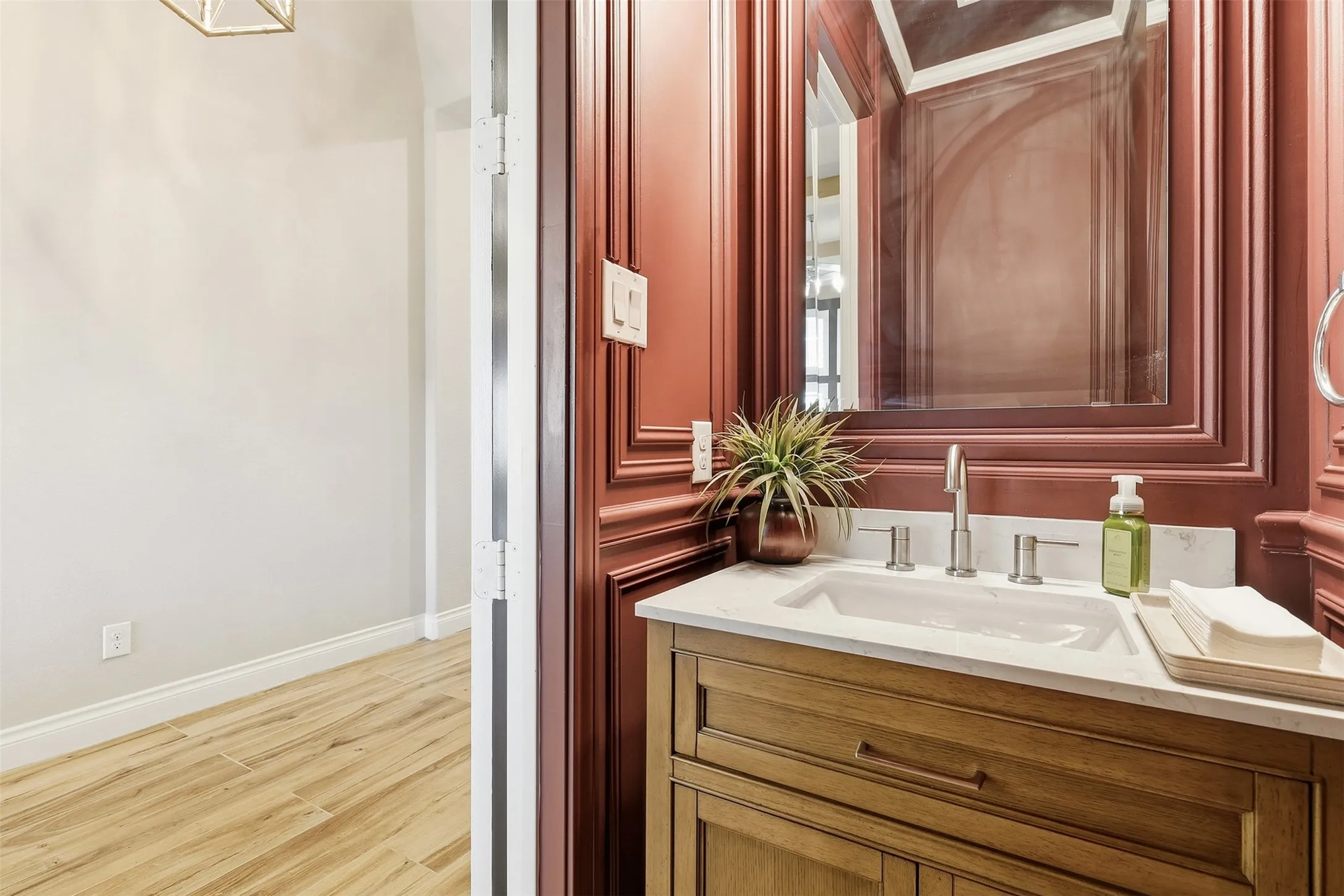 Vanity featuring a white countertop, inset sink, and brushed nickel fixtures
