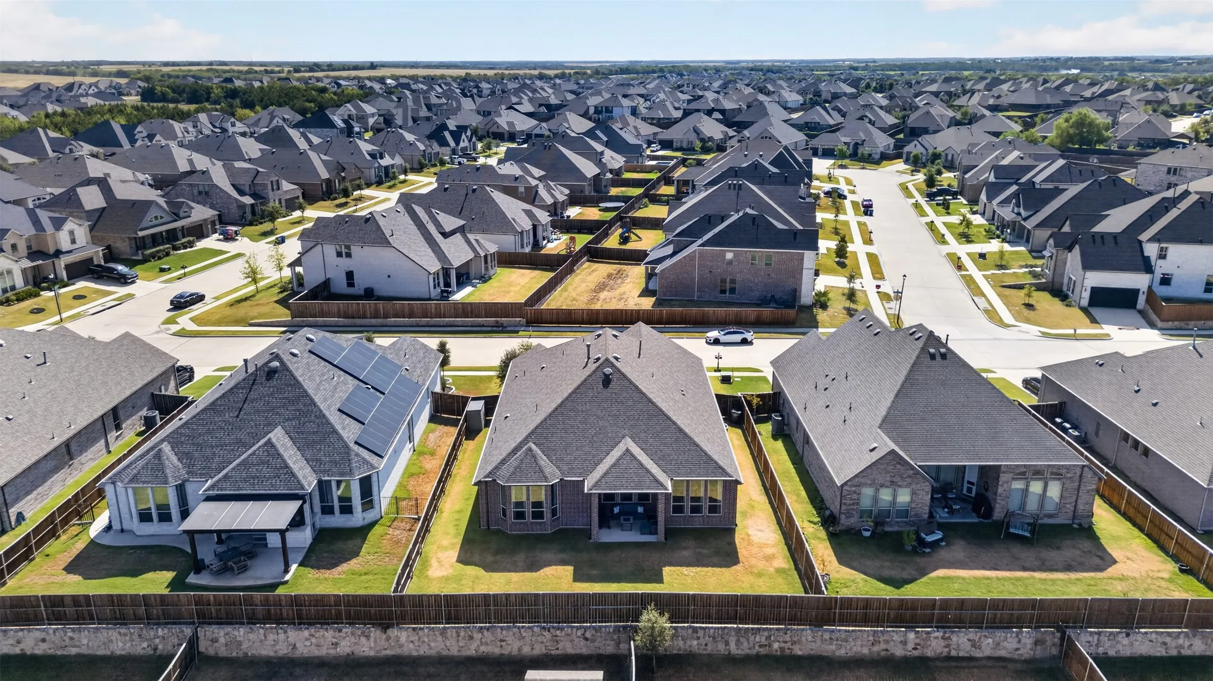 Aerial perspective showcasing a residential development with uniform architectural styles