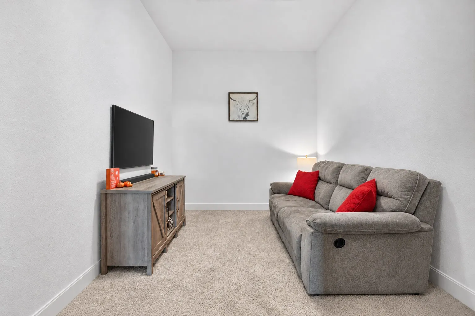 Plush carpeting and crisp white walls define this interior space
