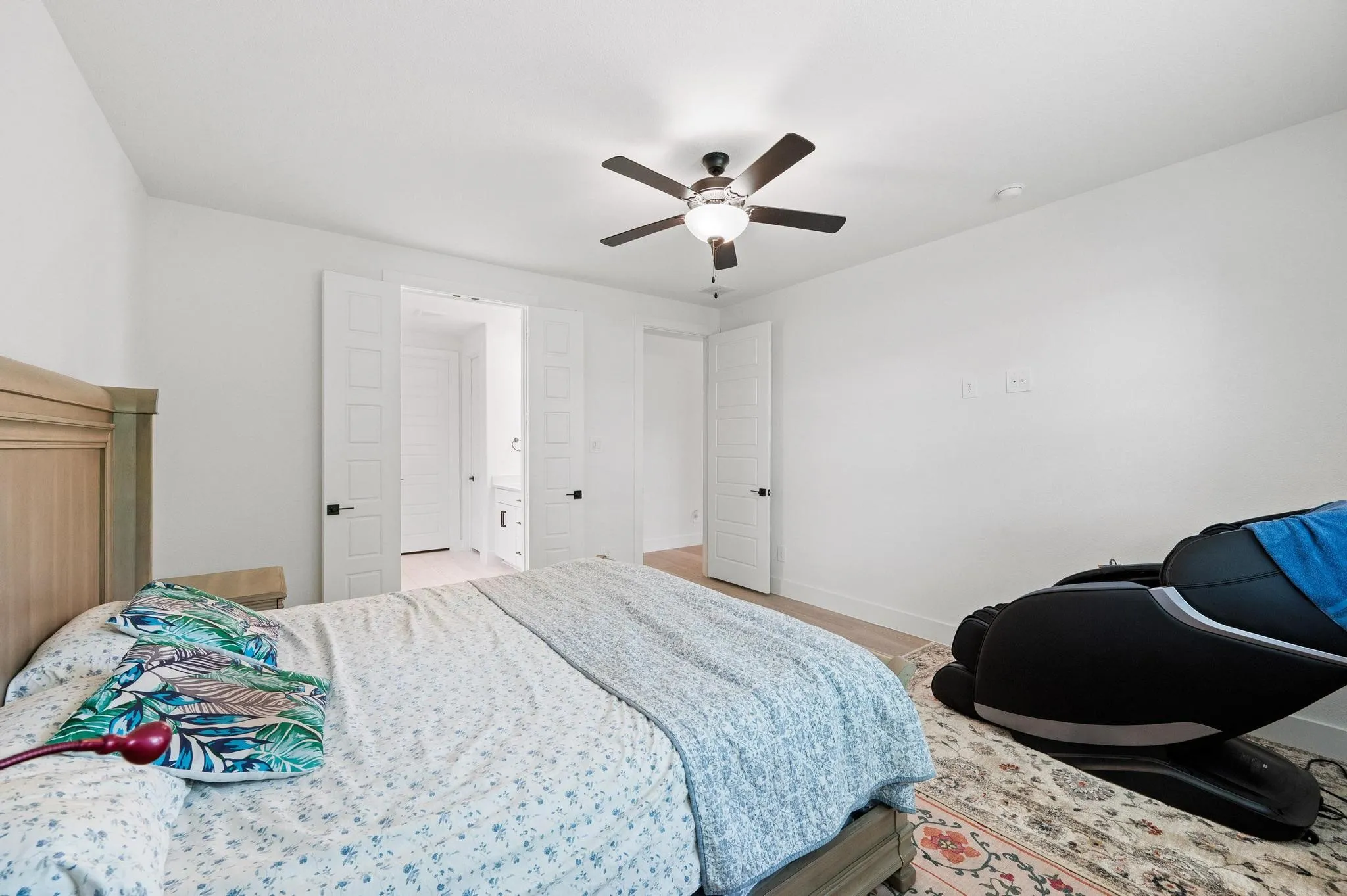 White walls and light wood-finish flooring