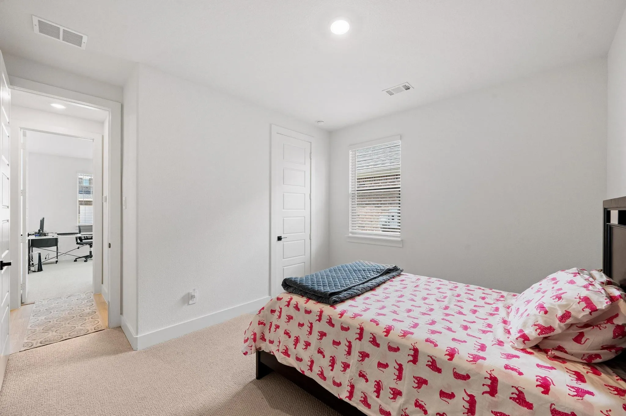 Recessed lighting, wall-to-wall carpeting, and five-panel interior door