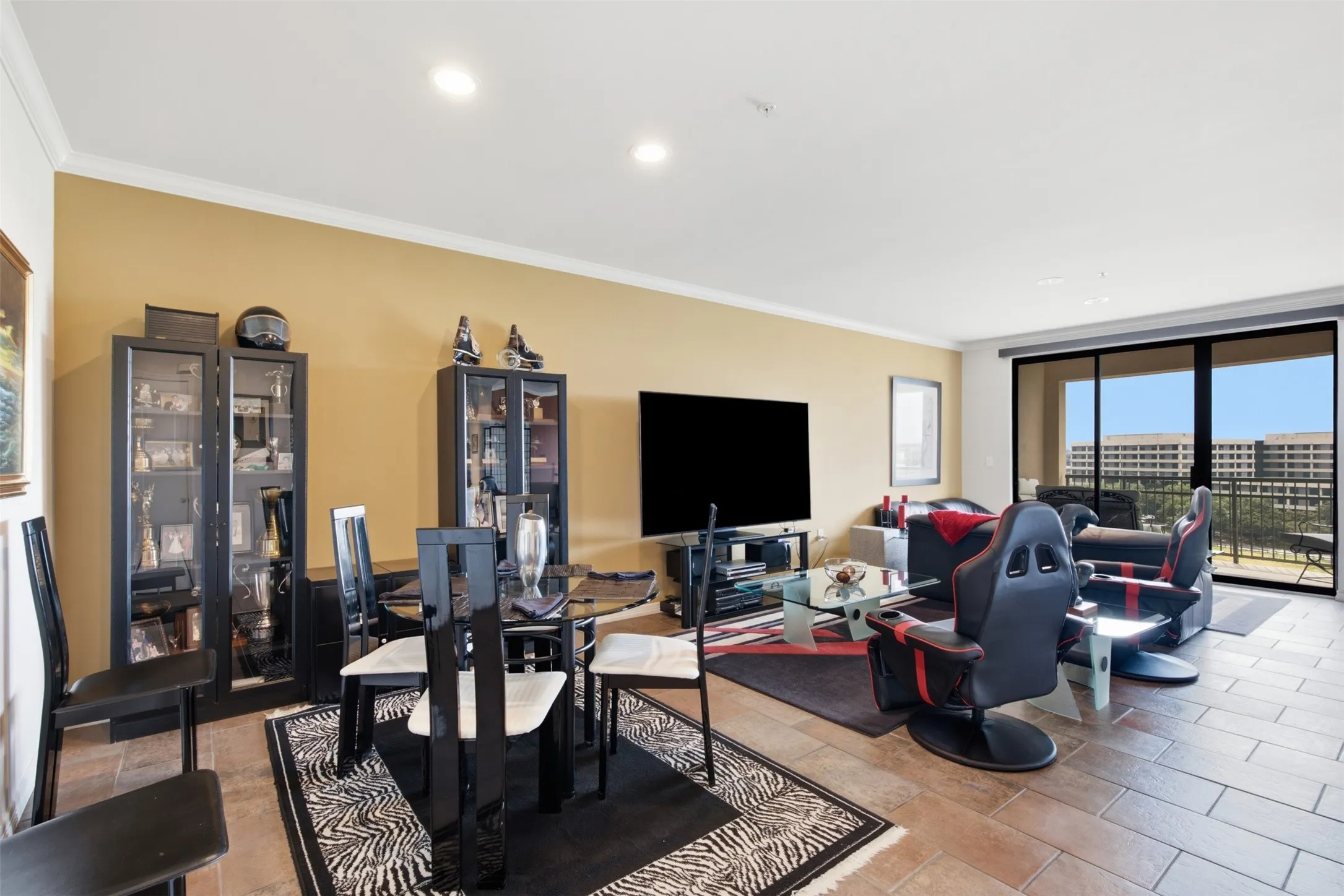 Crown molding, recessed lighting, and tile flooring