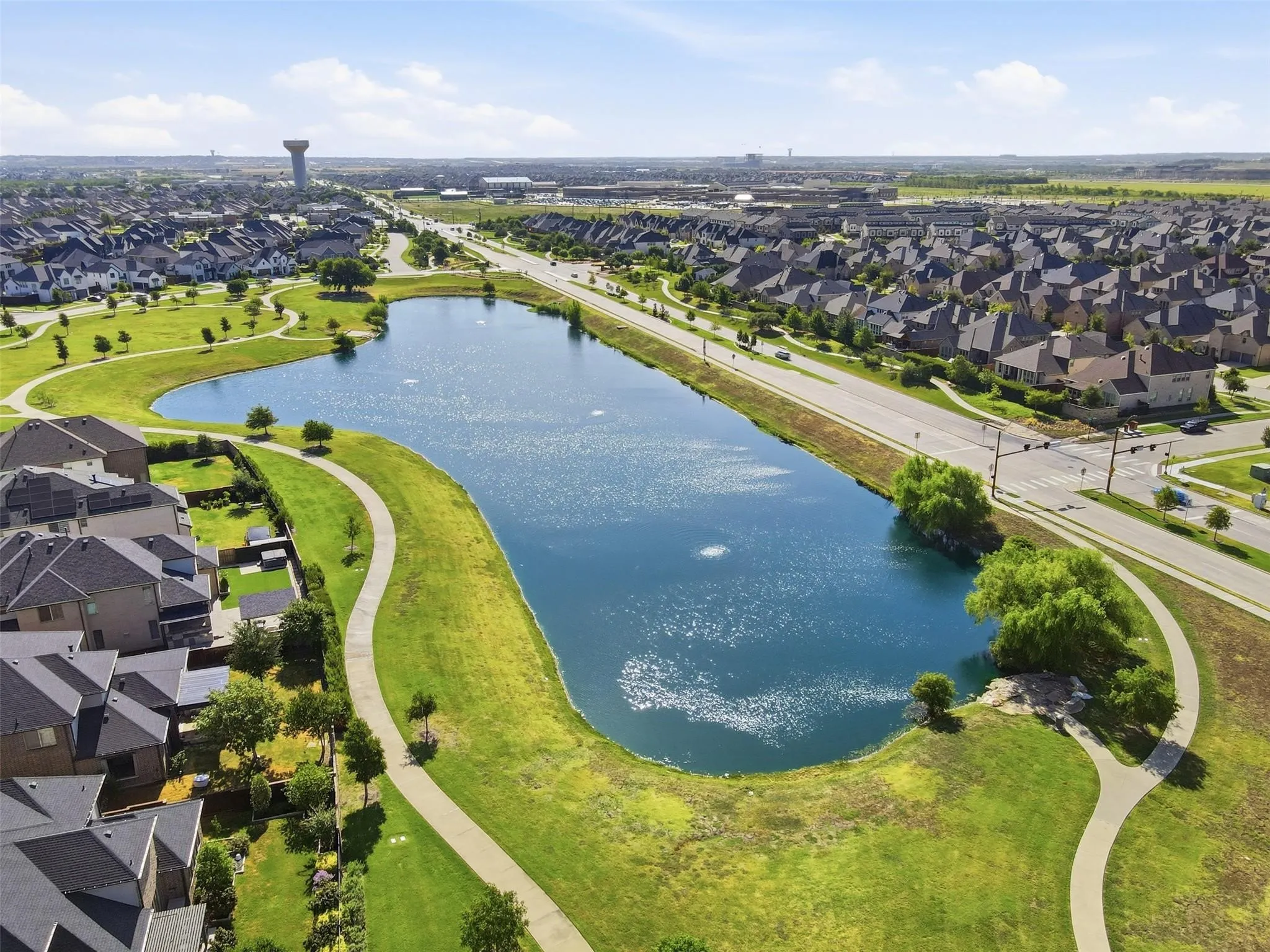 Water feature with surrounding pathways and green spaces