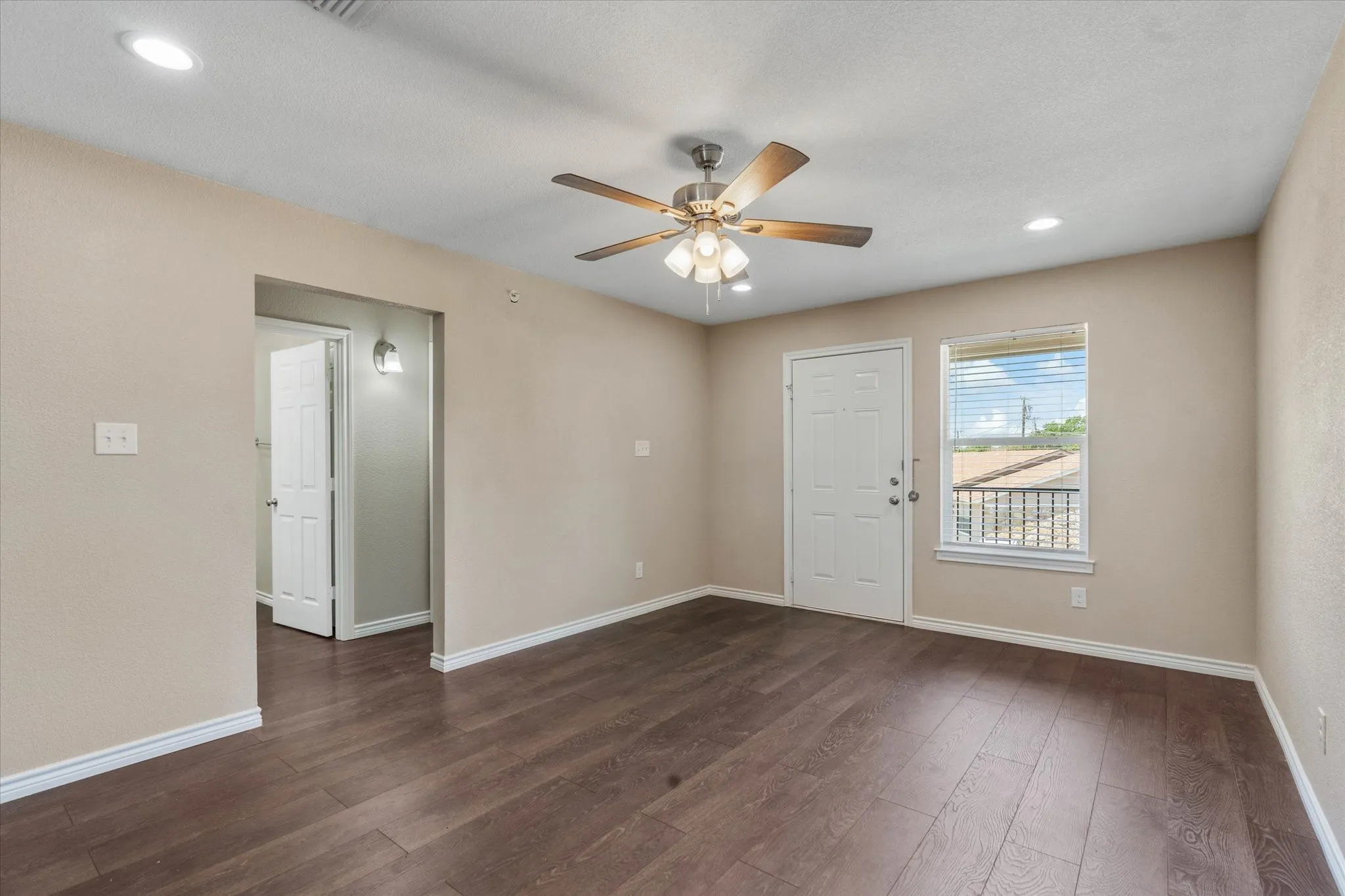Foyer featuring dark hardwood / wood-style flooring and ceiling fan