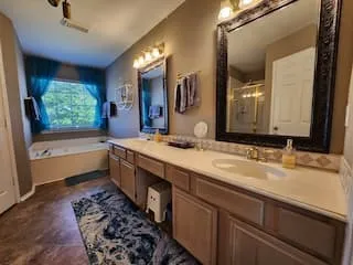 Dual vanity with integrated sinks, framed mirrors, and ample counter space