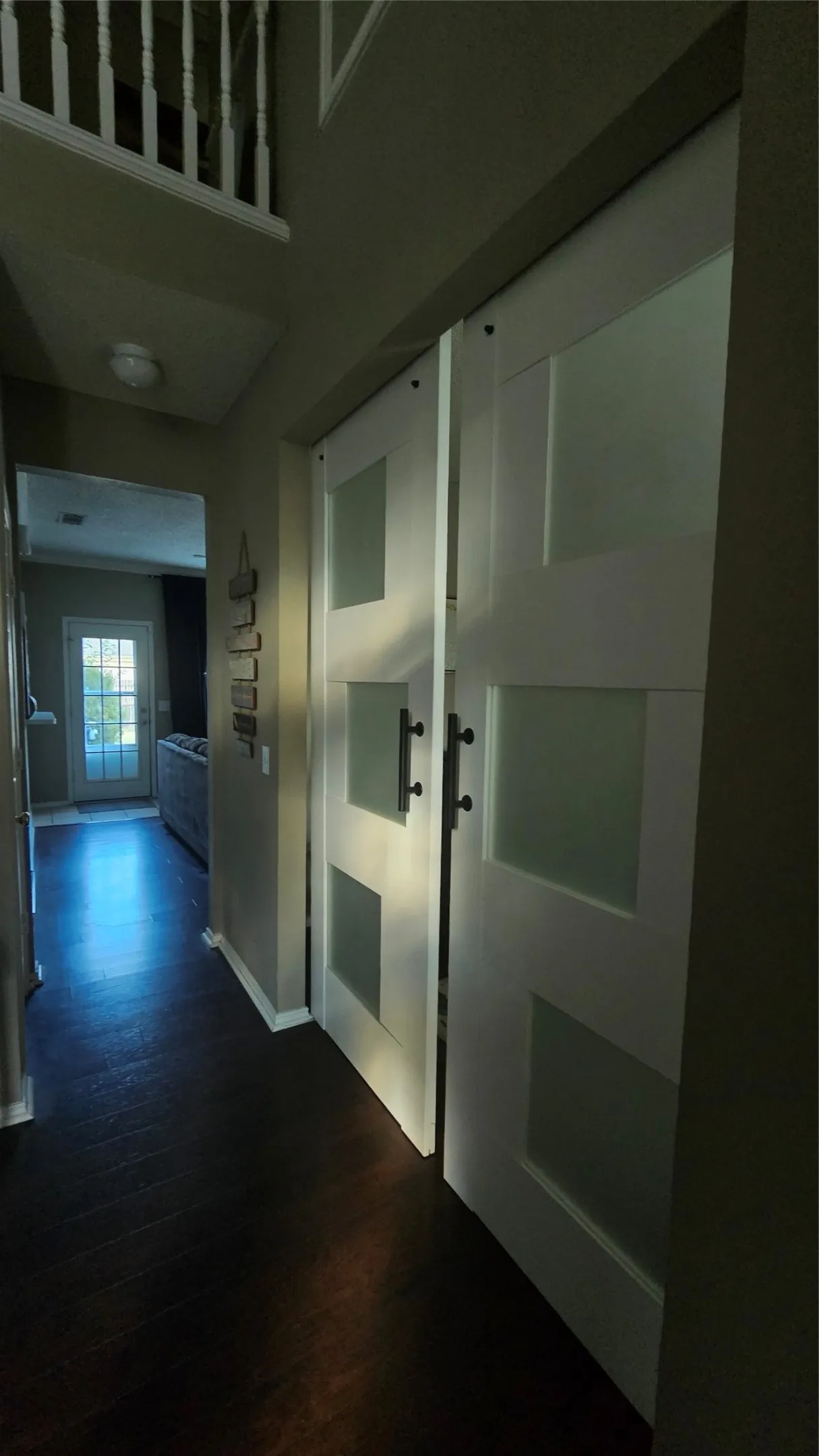 Walk-in shower with gold-tone frame, built-in soaking tub with window, and a walk-in closet with shelving