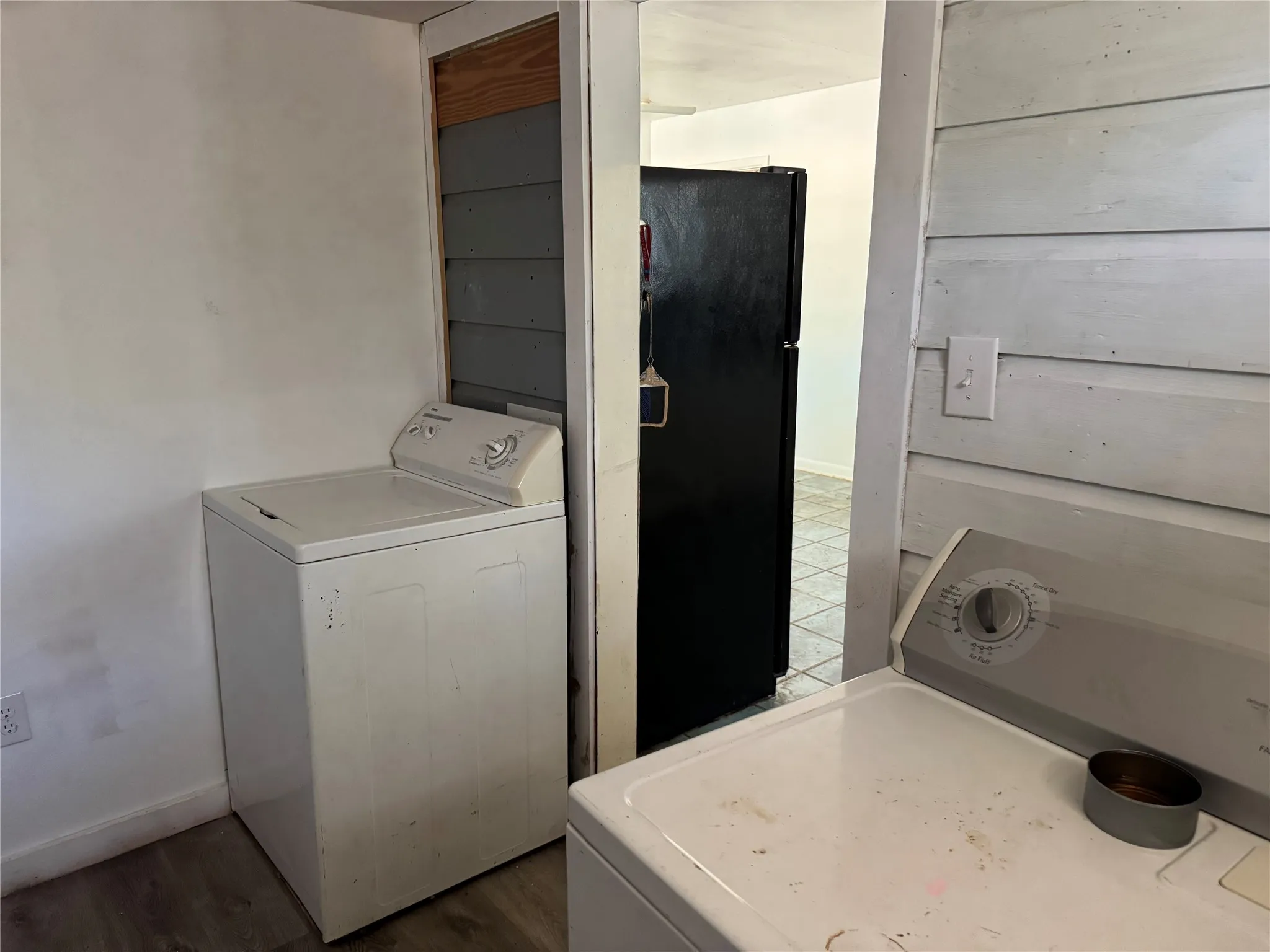 Large utility room. Washer, dryer, and fridge stay.
