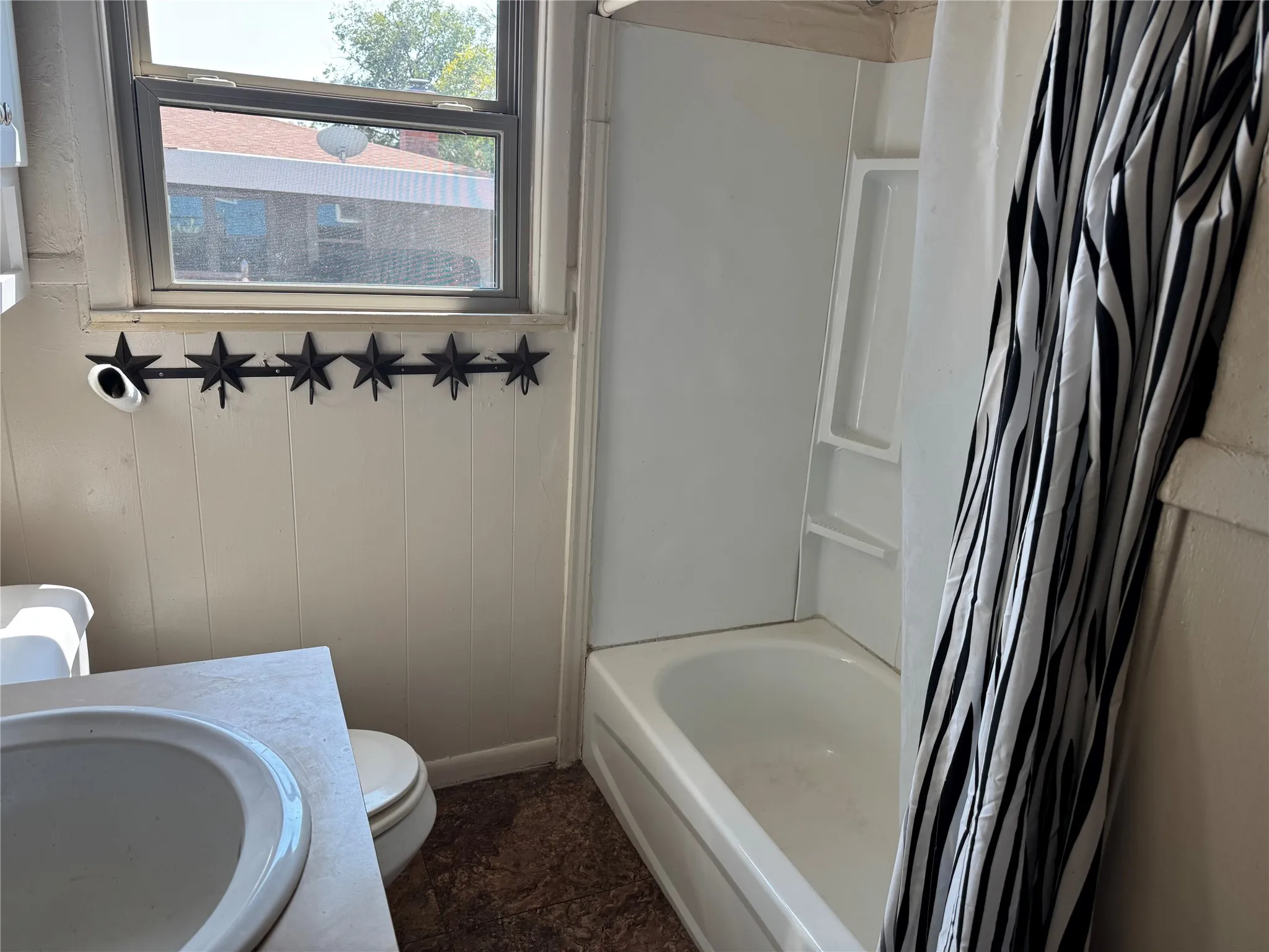 Bathroom with shower-tub combo and lots of storage!