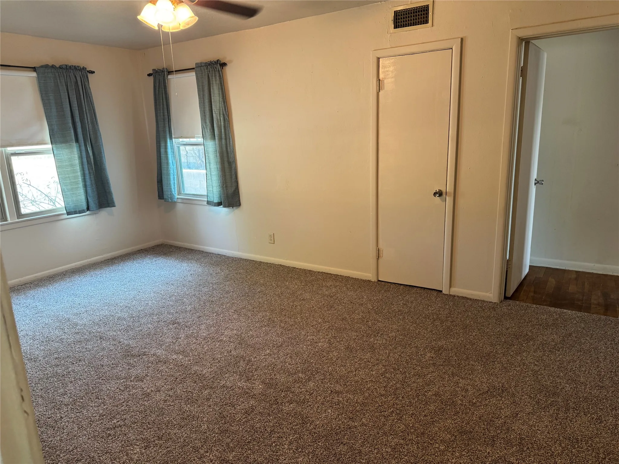 Primary bedroom with new carpet installed 2026.
