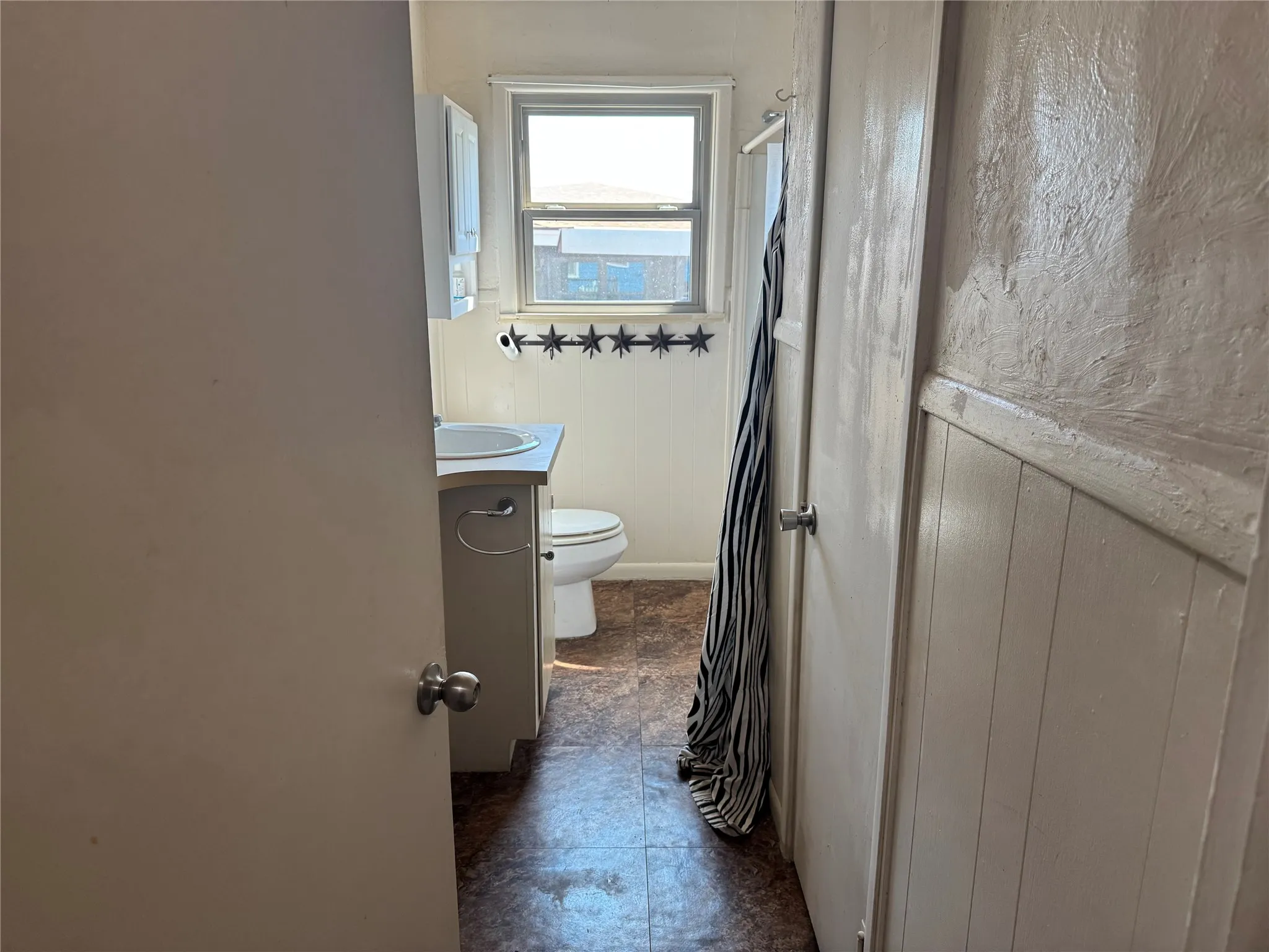 Bathroom with shower-tub combo and lots of storage!