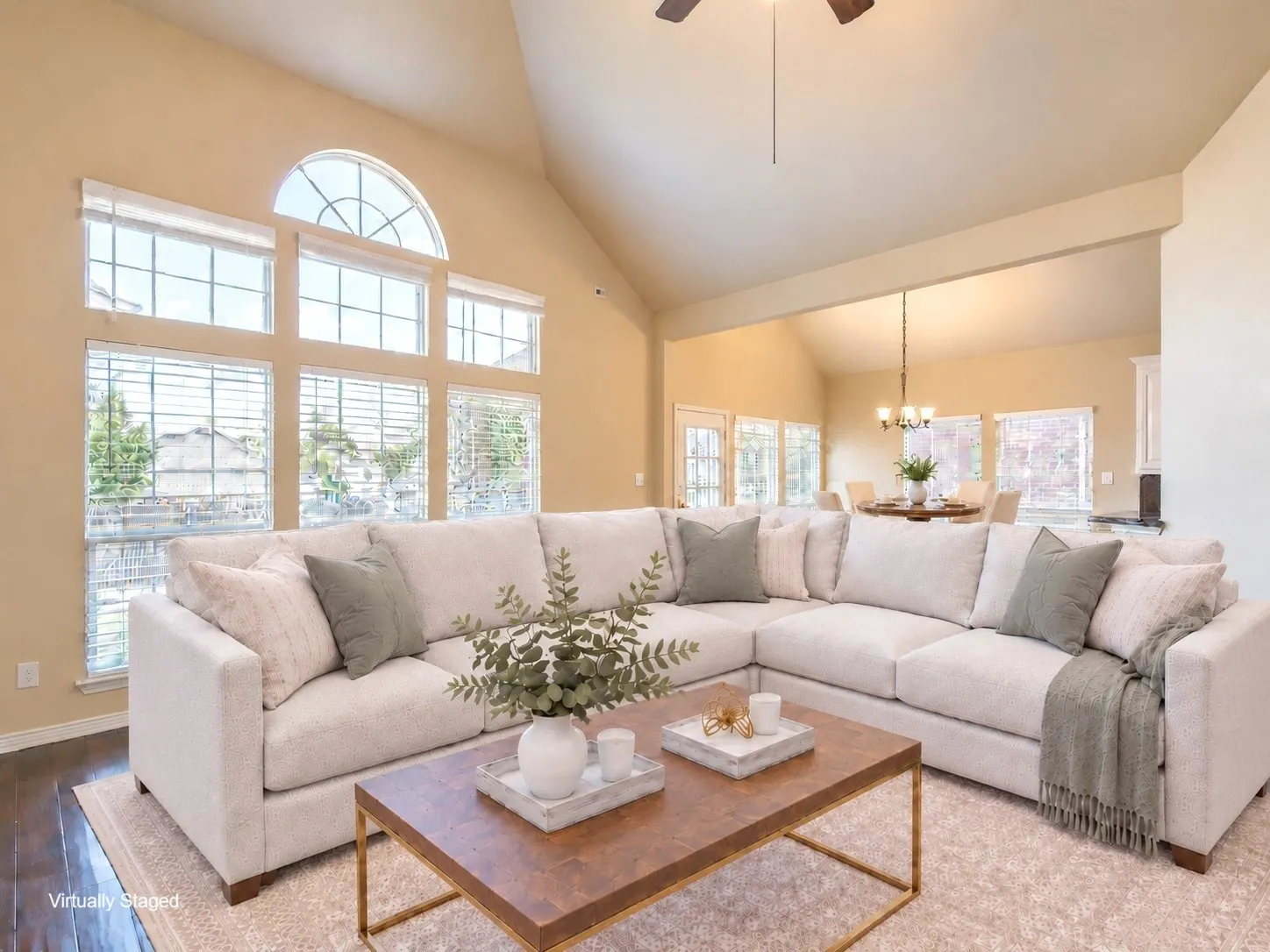 Vaulted ceiling, ceiling fan, wood-finish flooring, extensive window array with arch transom, recessed lighting