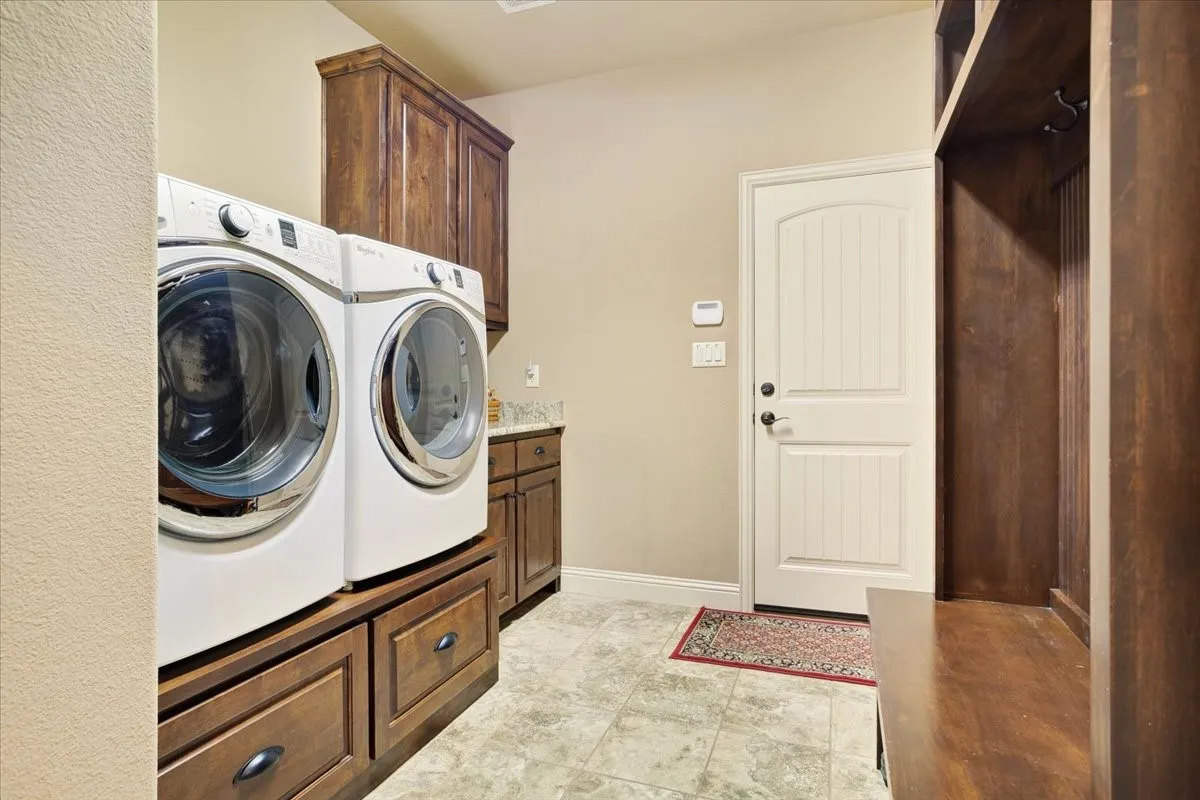 Built-in cabinetry, tile flooring, and light-toned wall finishes