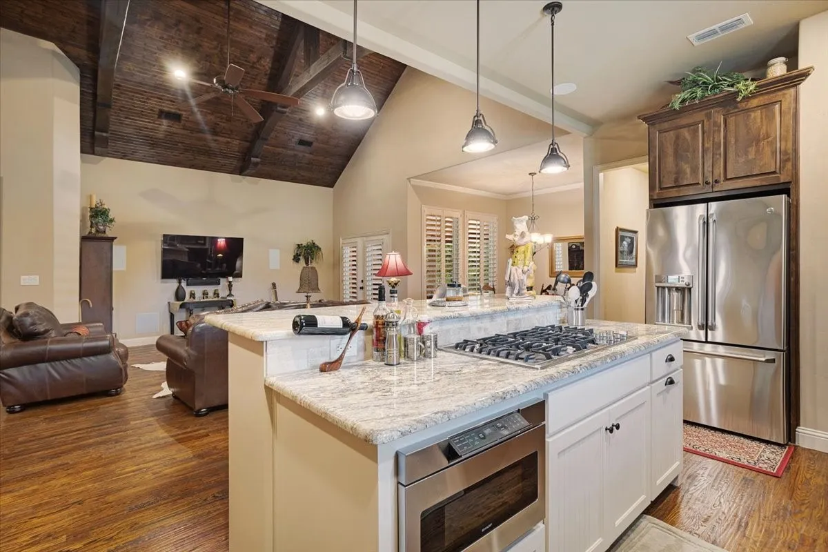 Kitchen island with gas cooktop and built-in microwave