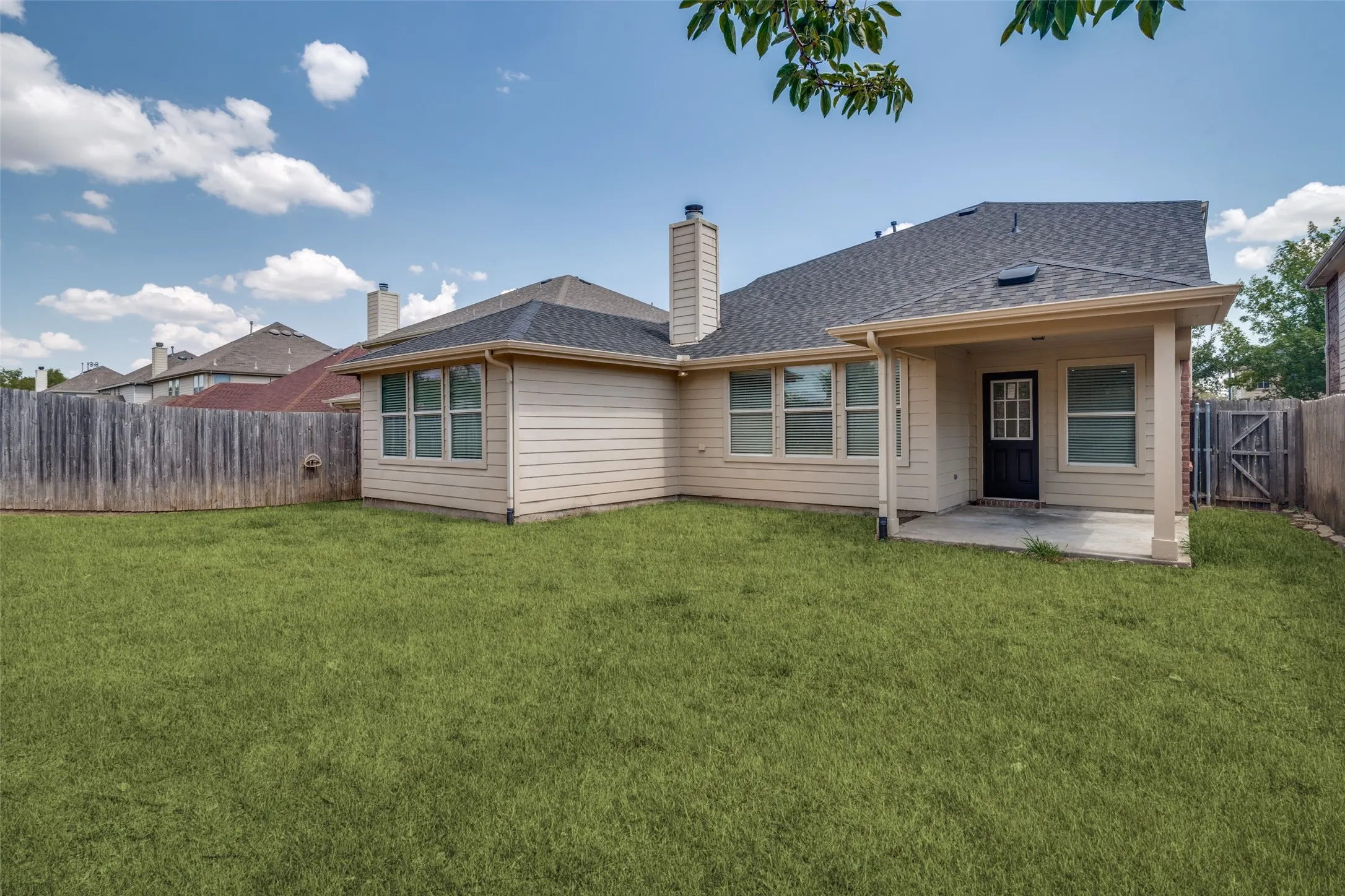 Backyard with covered patio-Green grass enhanced