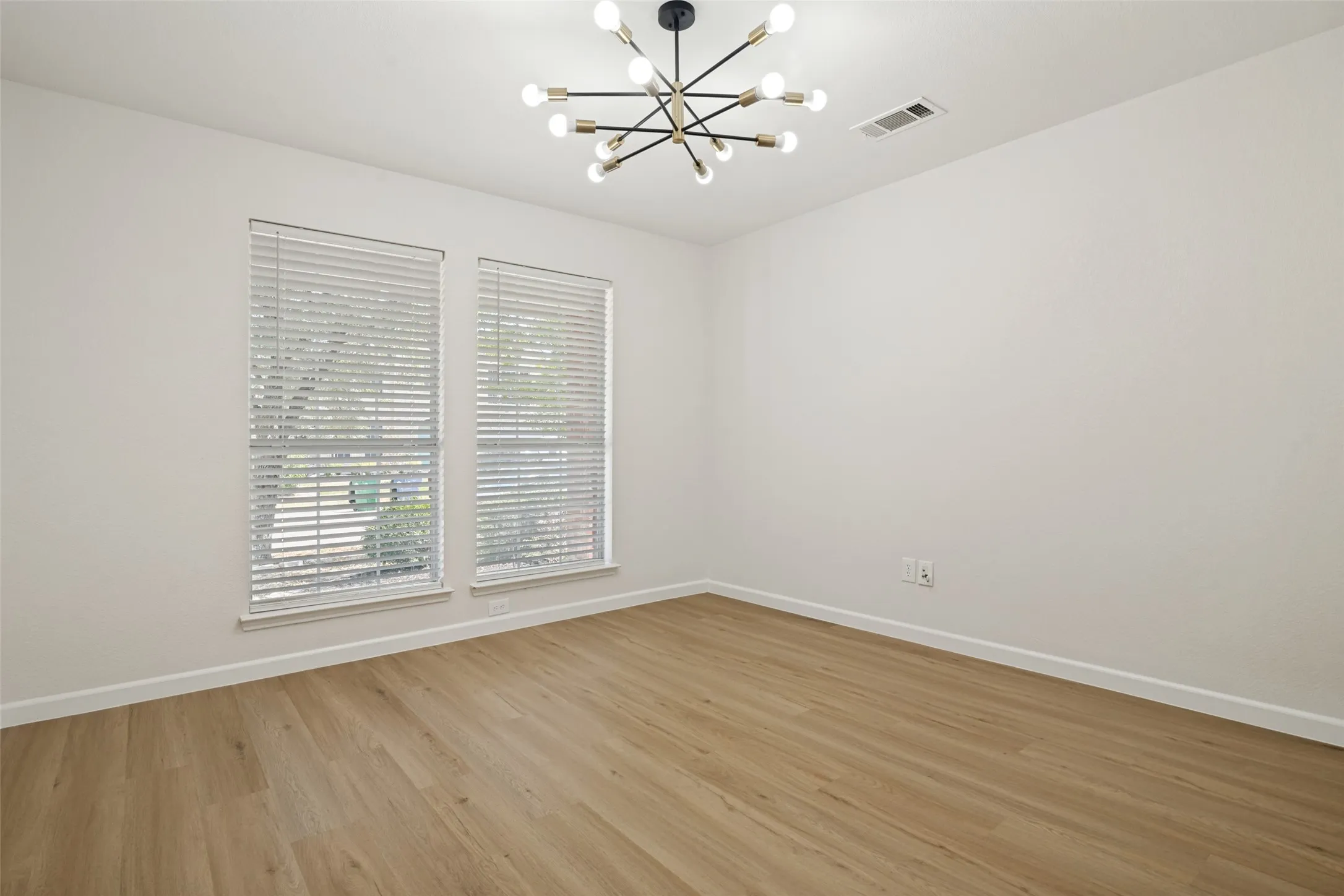 Office with french doors and decorative lighting
