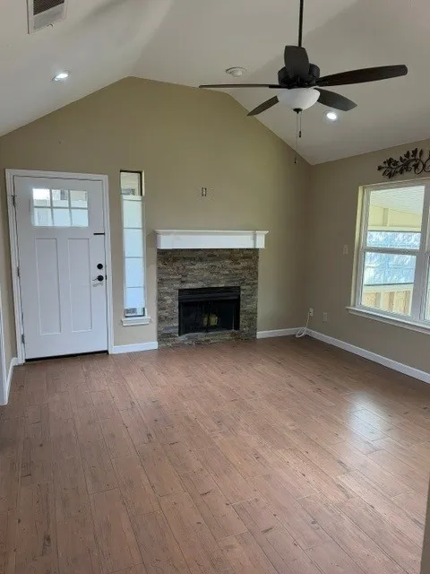 Beautiful tiled living room with slate wood burning fireplace