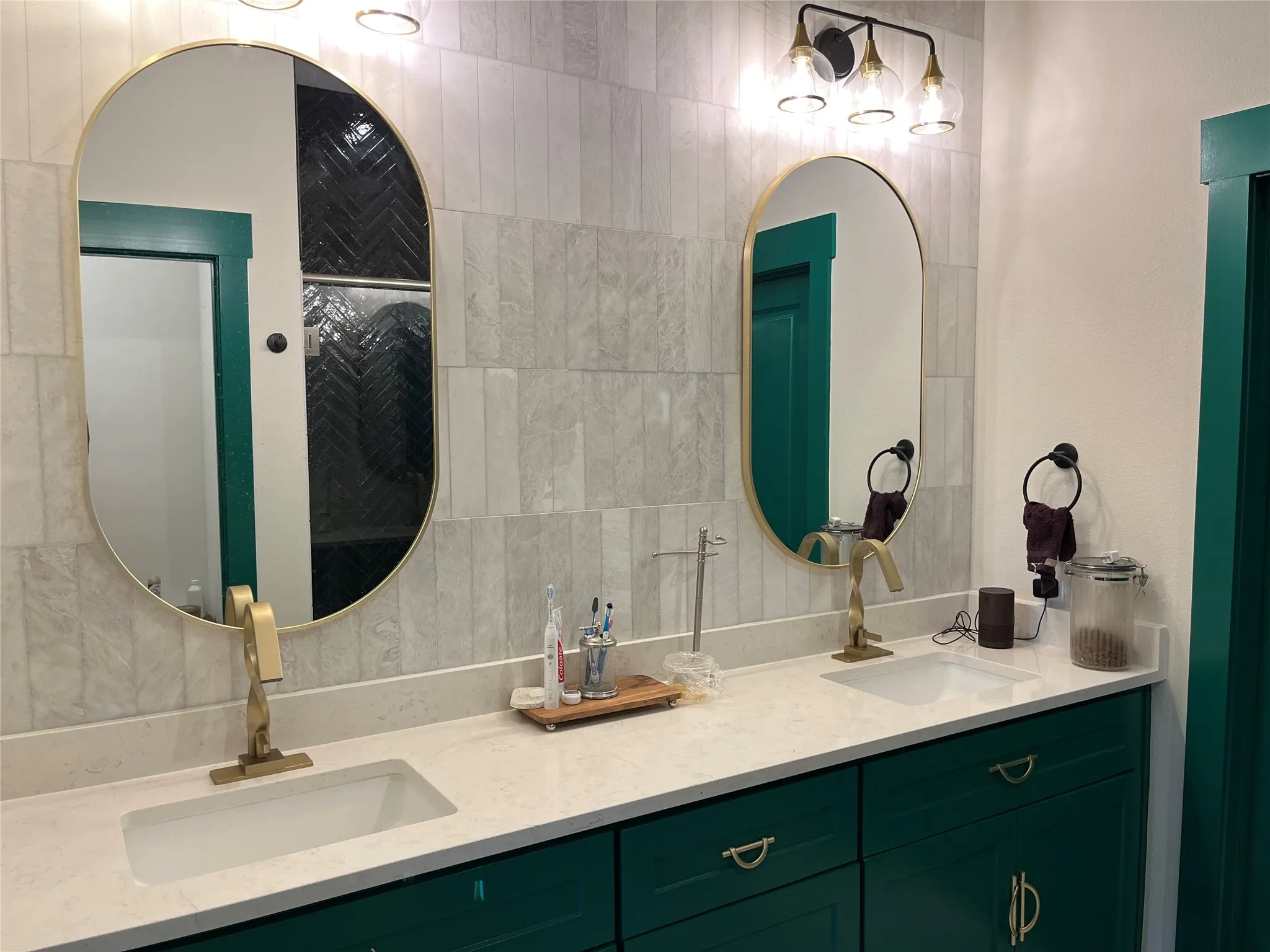 Natural marble tile backsplash all the way to the ceiling