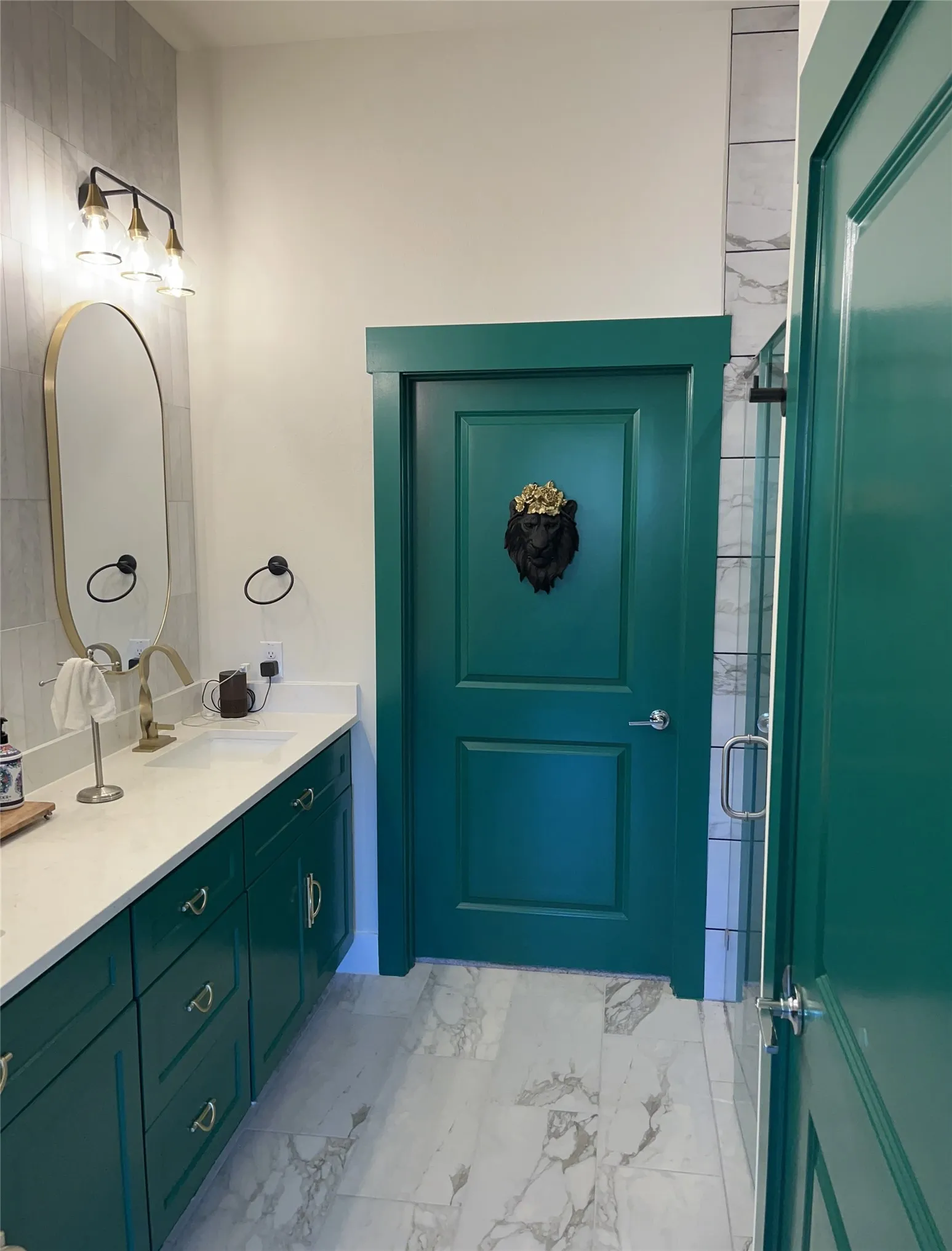 Emerald Green cabinets and doors provide a luxury design