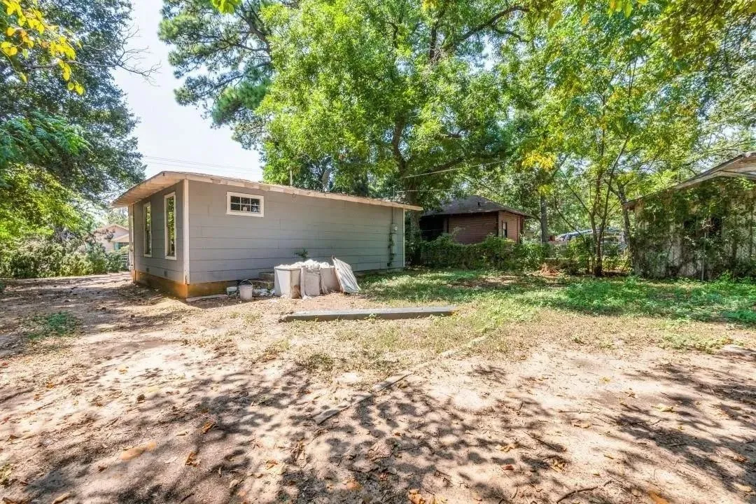 Spacious lot nestled among mature trees offering natural privacy and shade