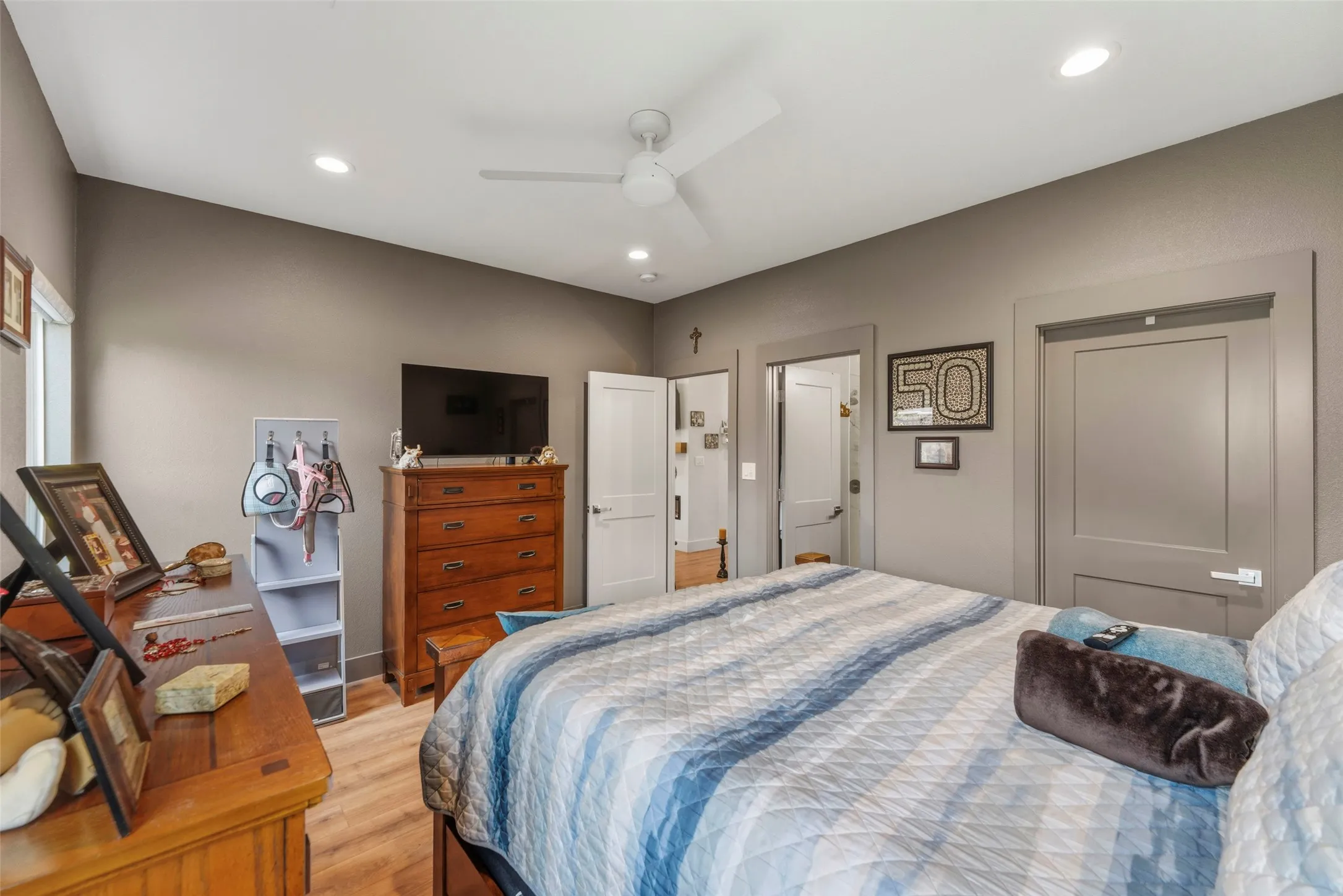 Bedroom featuring wood-finish flooring, recessed lighting, and a ceiling fan