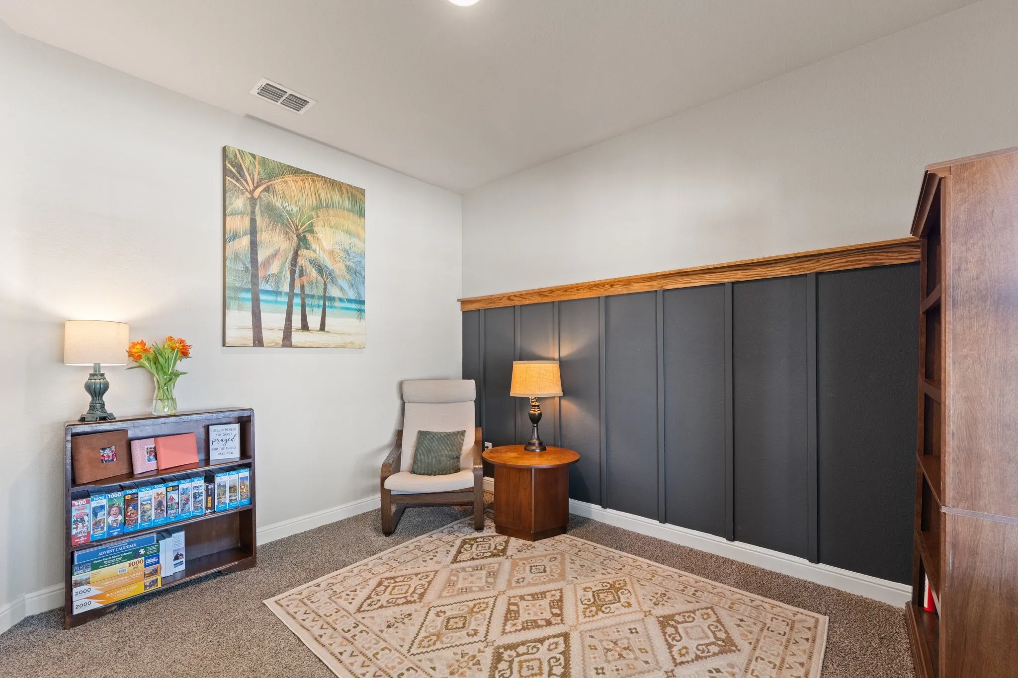 Carpeted flooring, recessed lighting, and a detailed board and batten wall with wood trim