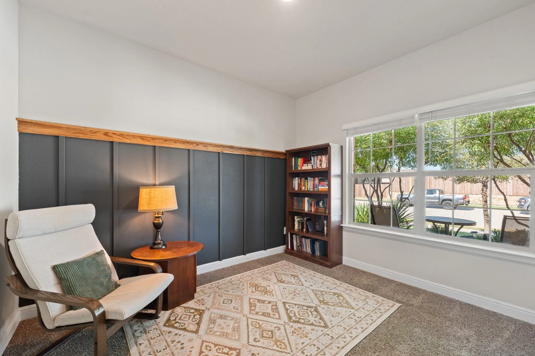 Accent wall with vertical paneling and wood trim