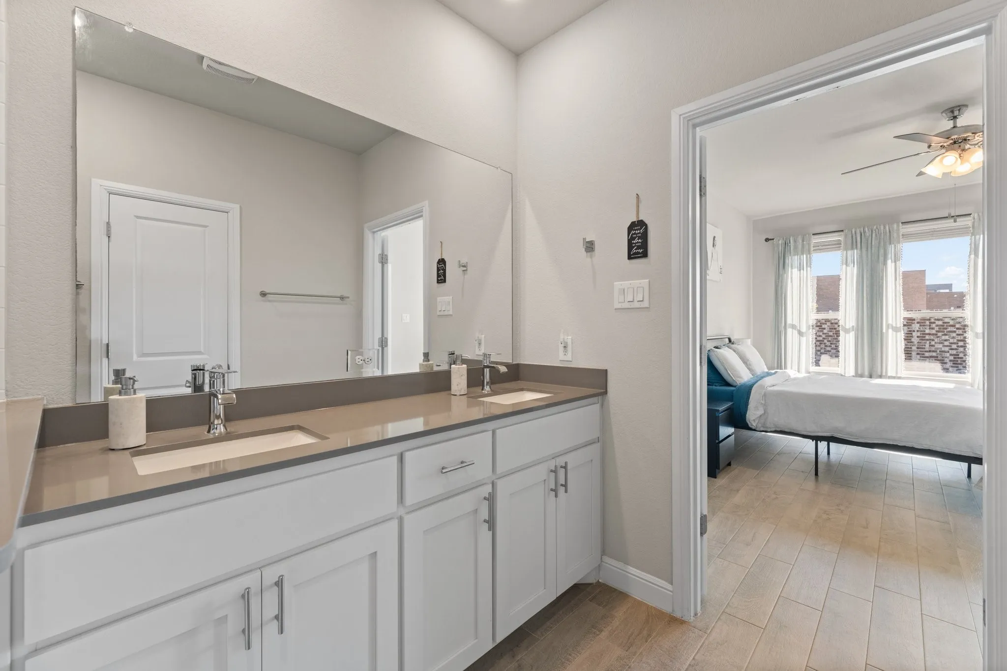 Dual vanity with undermount sinks and light-toned countertops