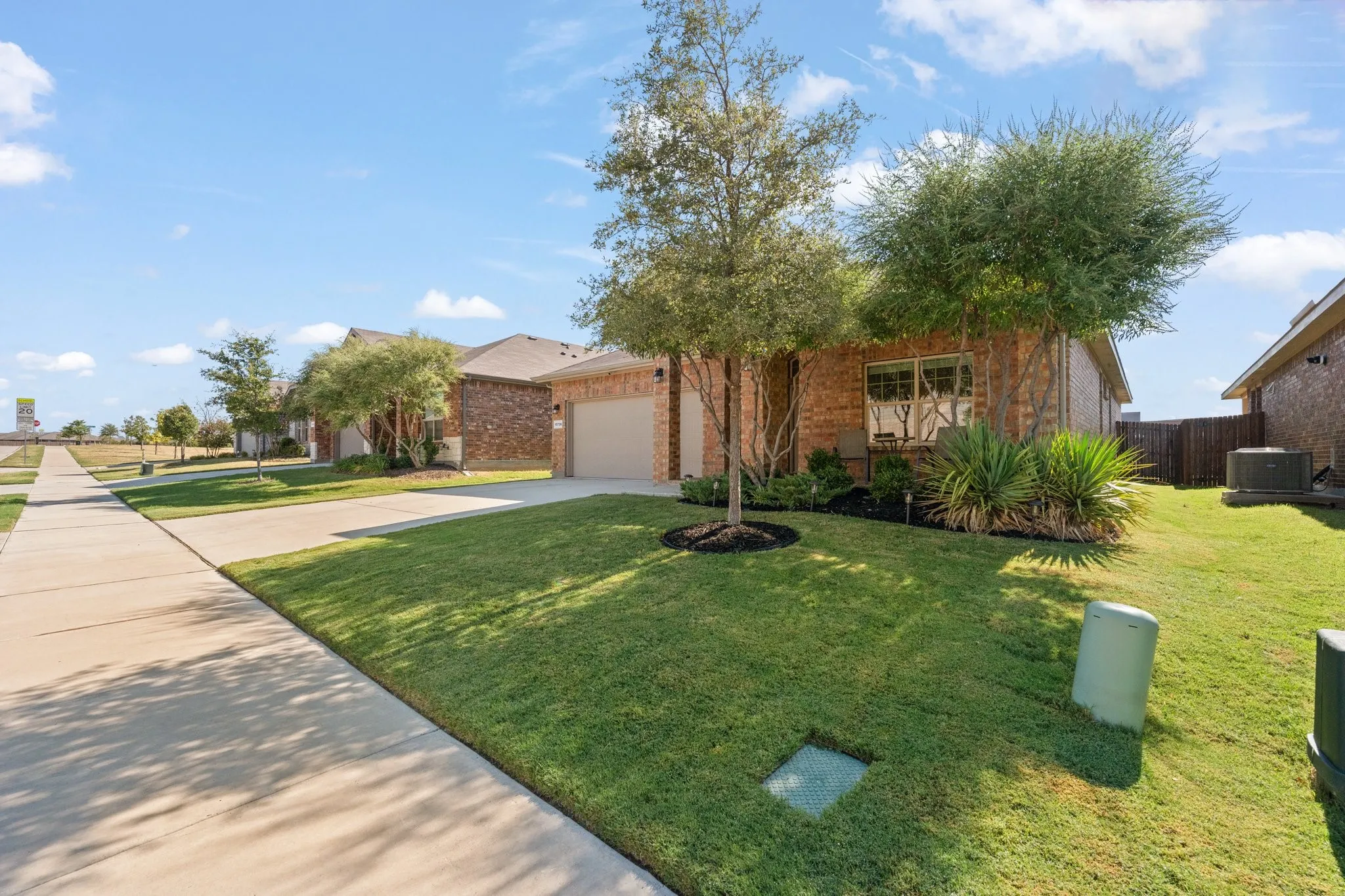 Brick exterior with attached garage