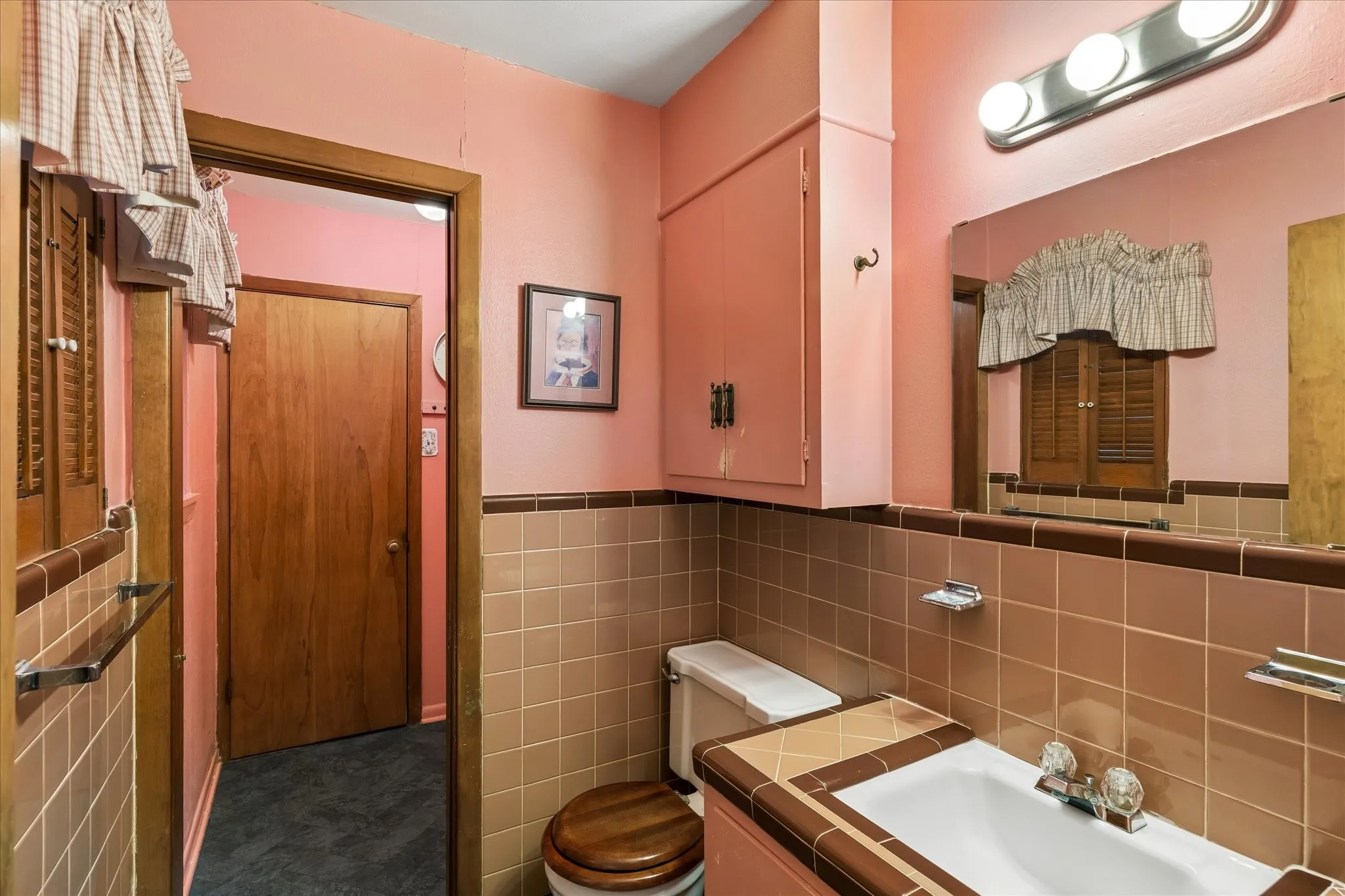 Half bath with room to expand to a full bath by installing a shower in the old utitliy area.