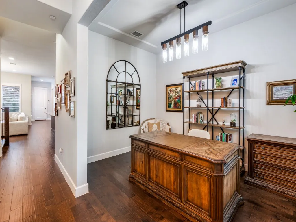 The dining room features is currently being used as a home office.