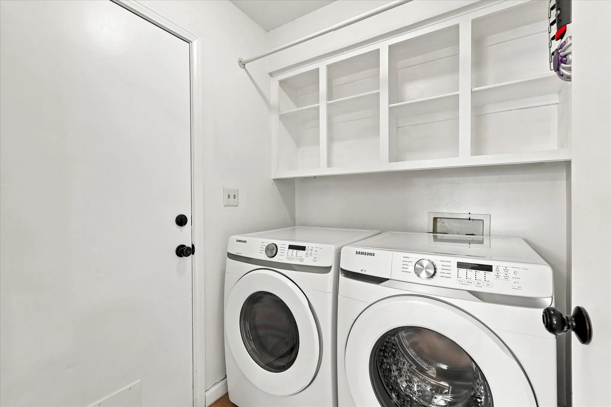 Laundry room is tucked in behind the kitchen & just off of the breakfast area.