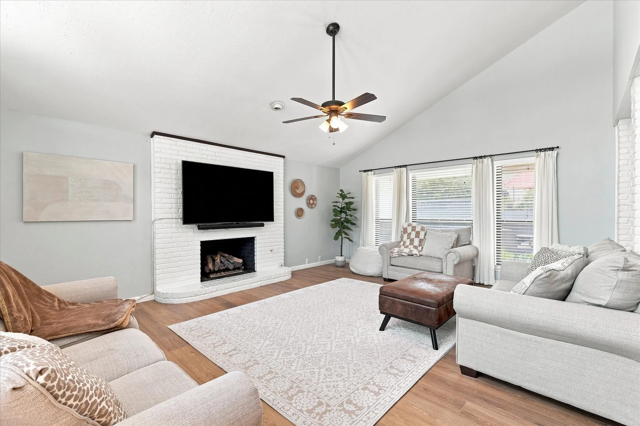 Large living room just off of the entry. Gas fireplace with logs.