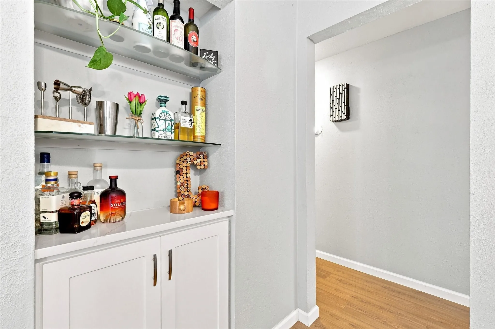 Dry bar, butlers pantry, extra storage.
