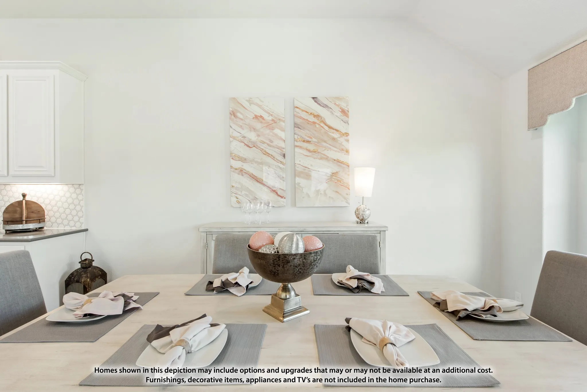 Vaulted ceiling, white cabinetry, dark countertops, white hexagonal tile backsplash, and a window with a fabric valance