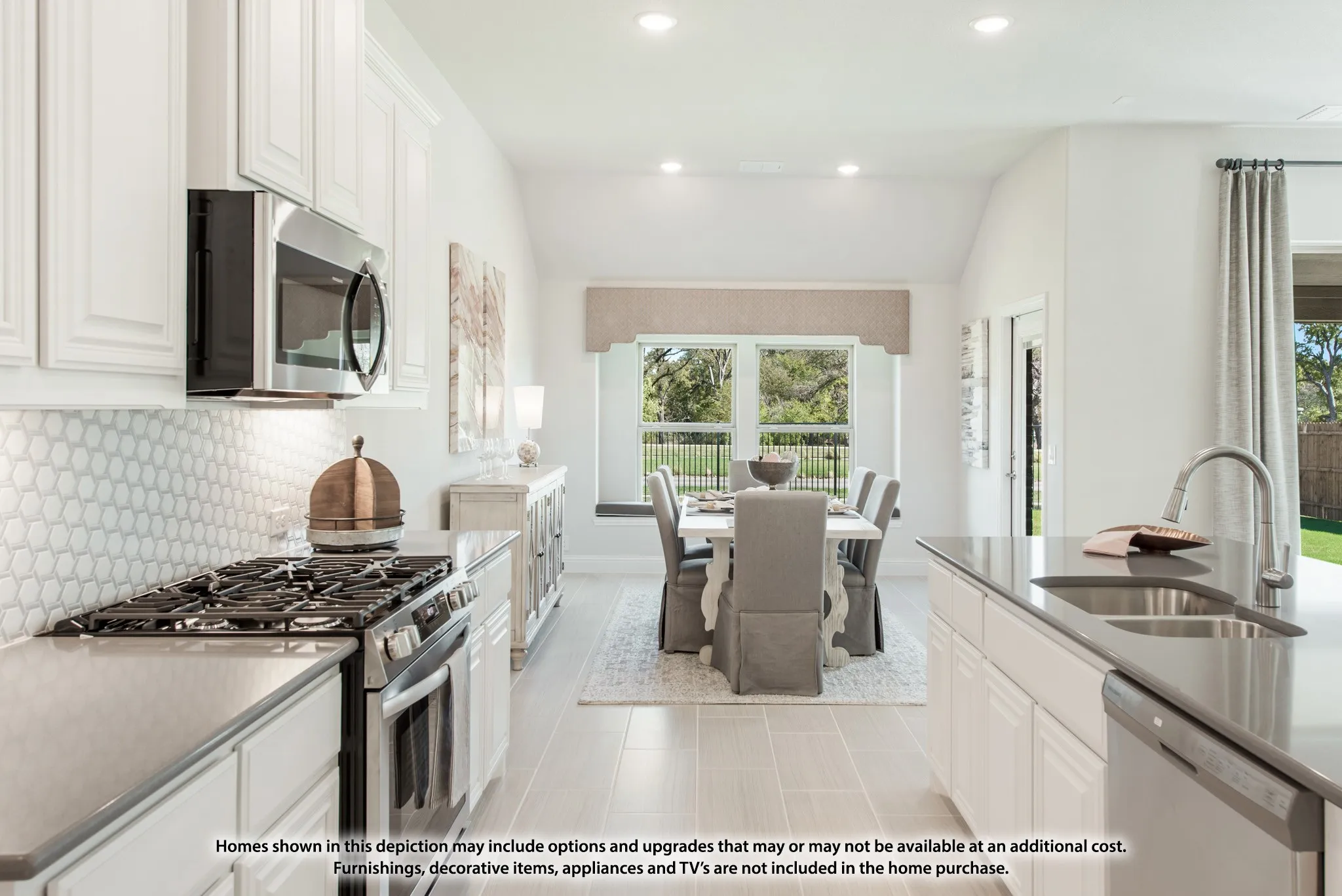 White shaker-style cabinetry, stainless steel appliances, hexagonal tile backsplash, spacious kitchen island with undermount sink, and light-tone plank flooring