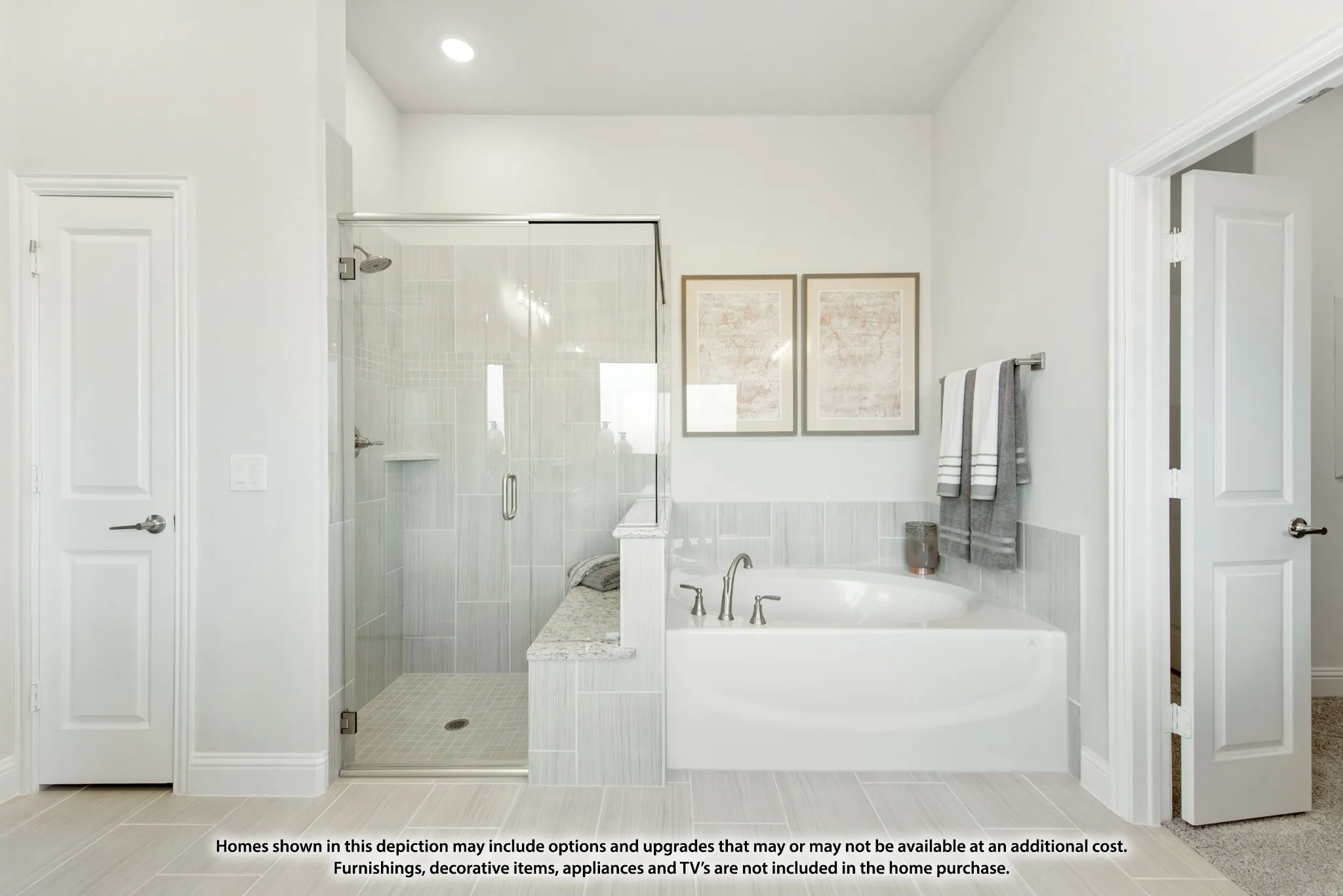 Glass-enclosed shower with tile surround and built-in bench