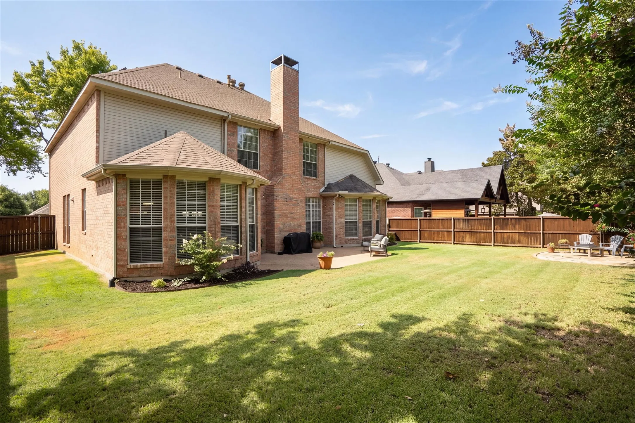 The back yard is ideal for relaxing or entertaining, with 2 patios and plenty of space to roam!