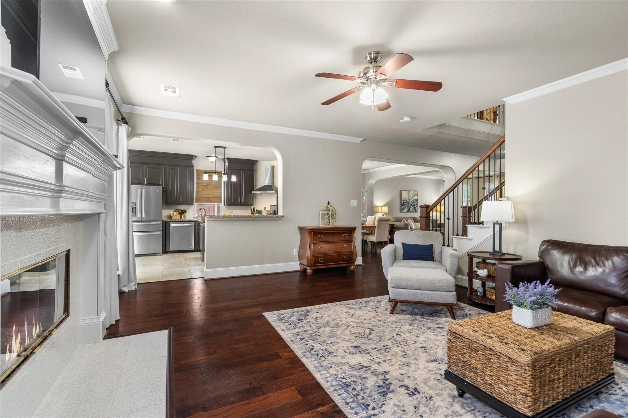 The rear of the home is more casual, with the kitchen, family room, and breakfast rooms all seamlessly connected and overlooking the tranquil back yard.