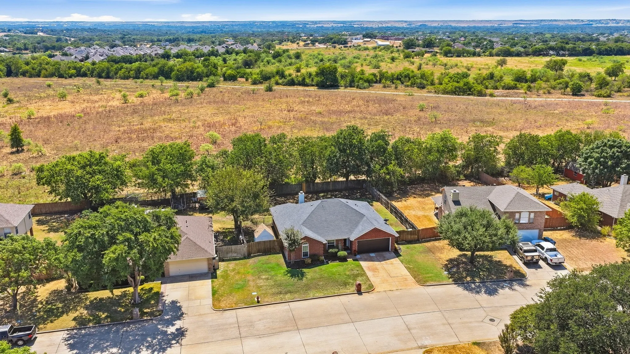 Single-story residence featuring a brick exterior and an attached garage