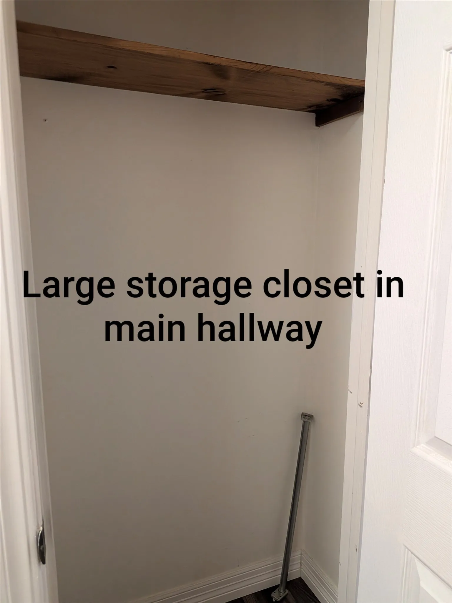 Large storage closet in long hallway