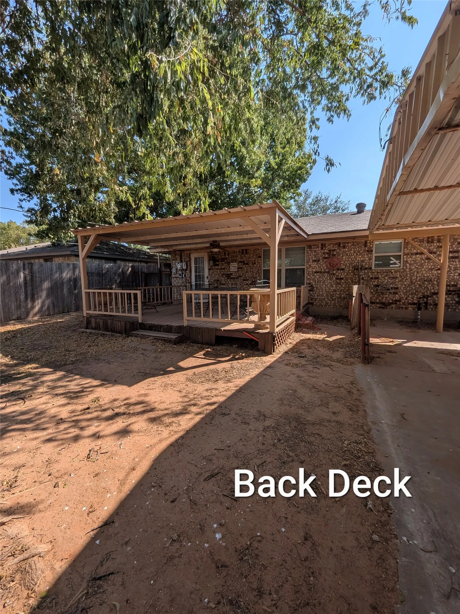 Covered deck on back of home